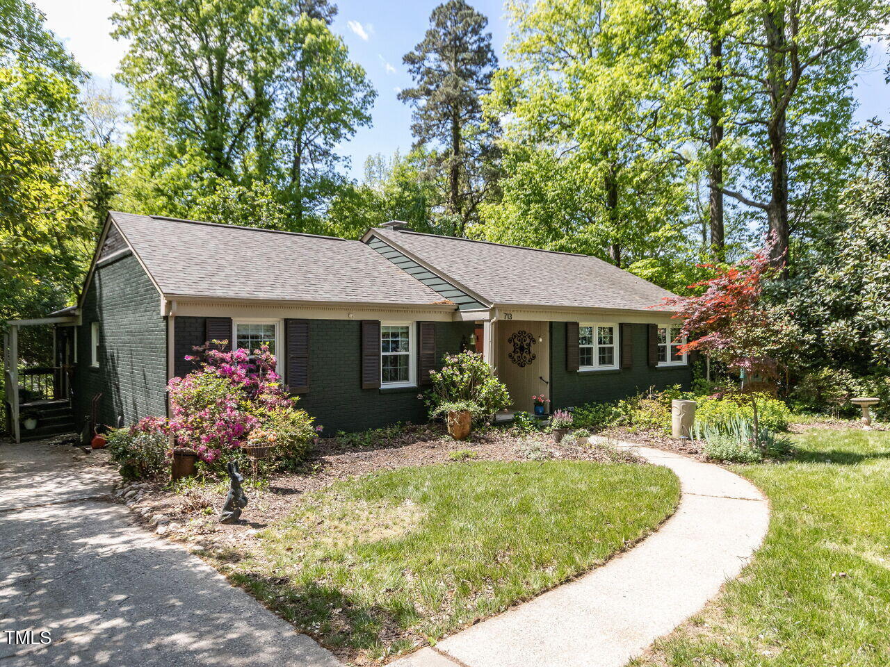 713 Macon Place Raleigh, NC 27609 - Photo 2 of 36 a front view of house with yard seating and green space