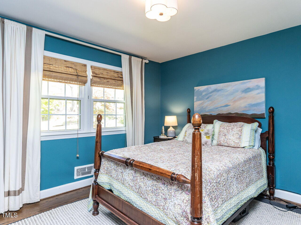 713 Macon Place Raleigh, NC 27609 - Photo 26 of 36 a bedroom with a large bed and a window