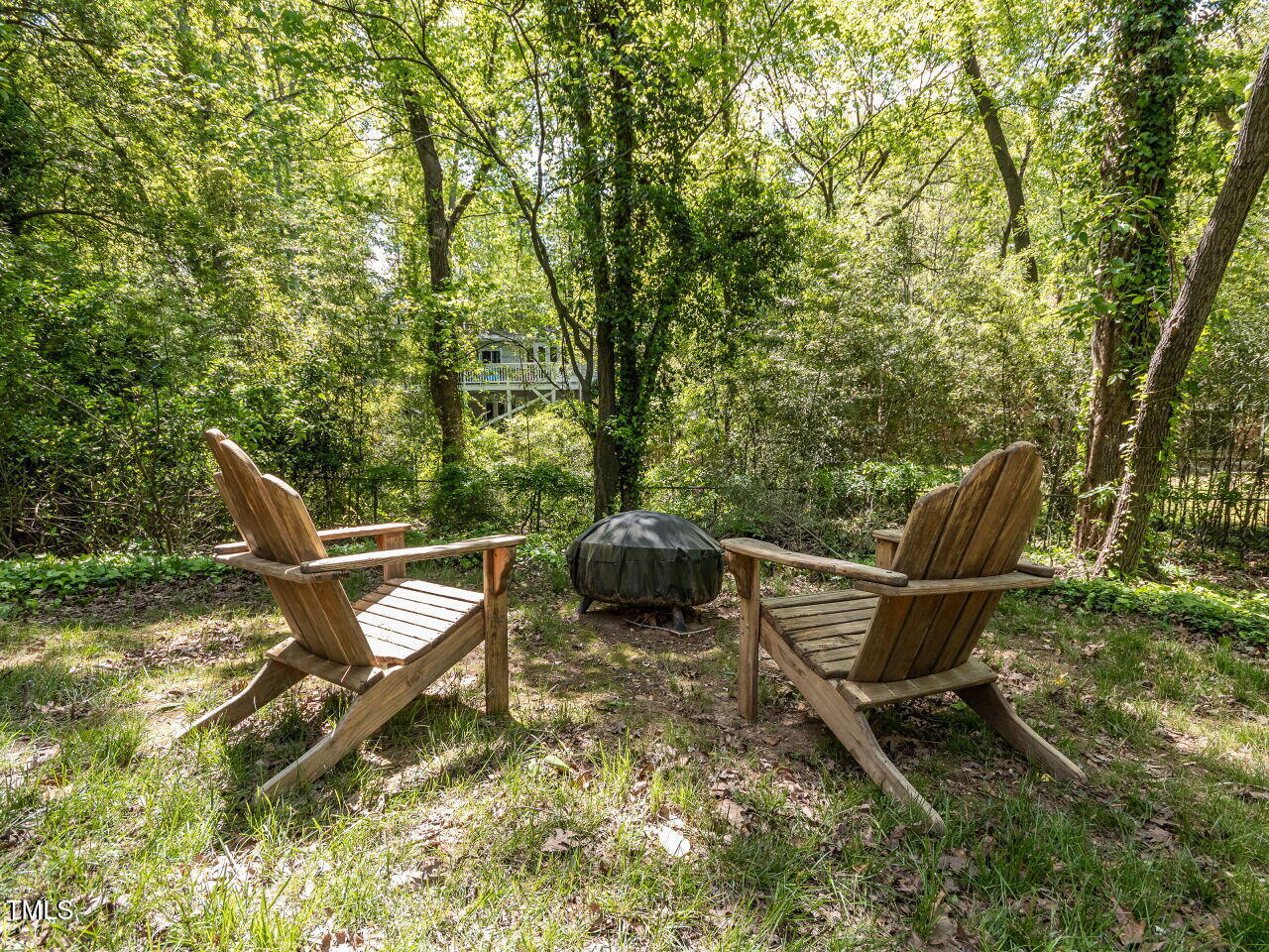 713 Macon Place Raleigh, NC 27609 - Photo 35 of 36 a view of a bench in a backyard