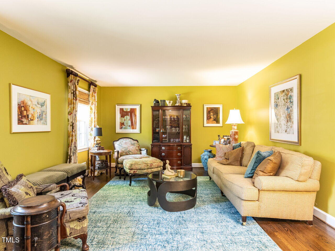 713 Macon Place Raleigh, NC 27609 - Photo 5 of 36 a living room with furniture and a couch