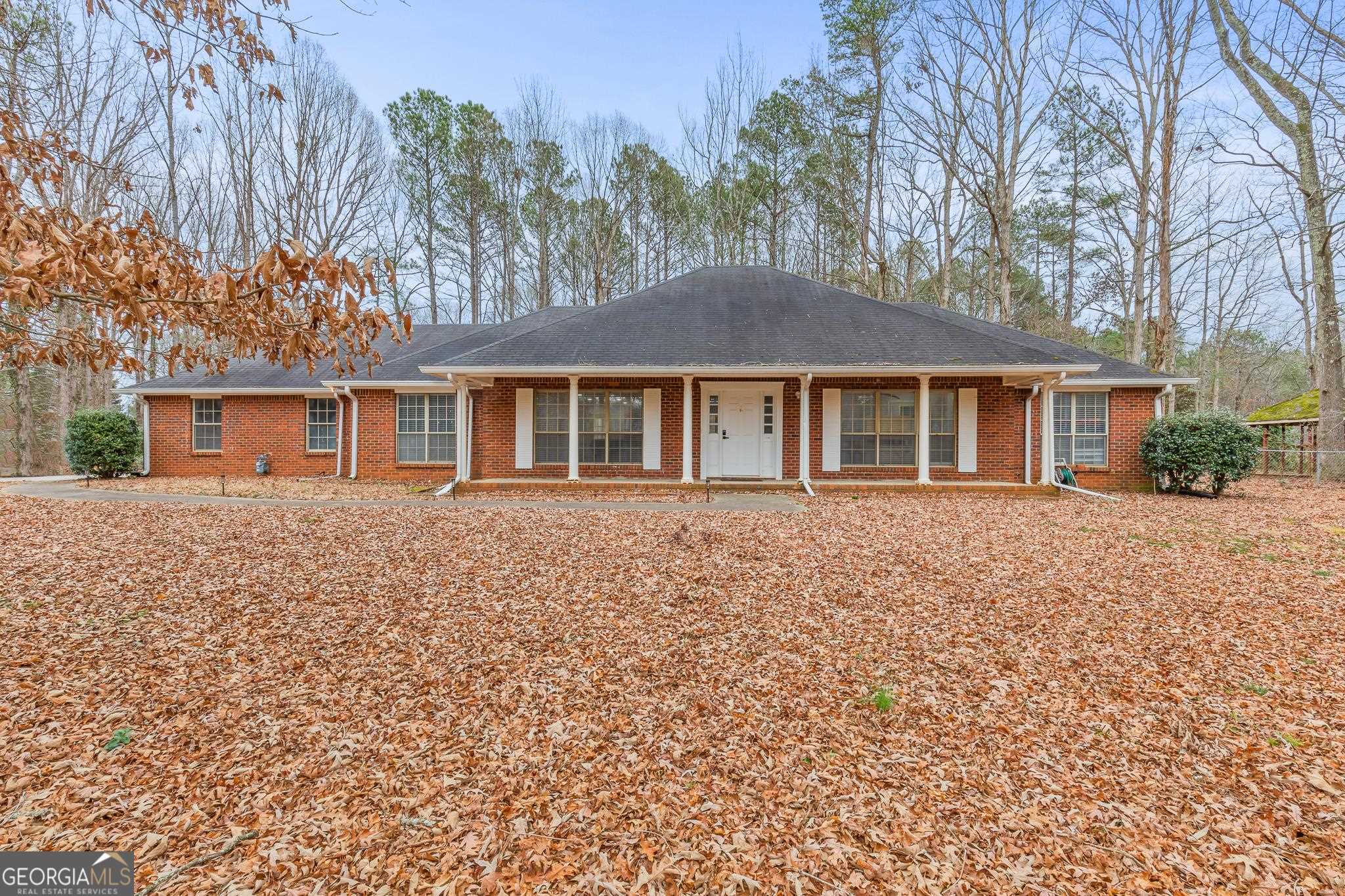 198 Carl Parker Road Hampton, GA 30228 - Photo 1 of 1 front view of a house with a garden