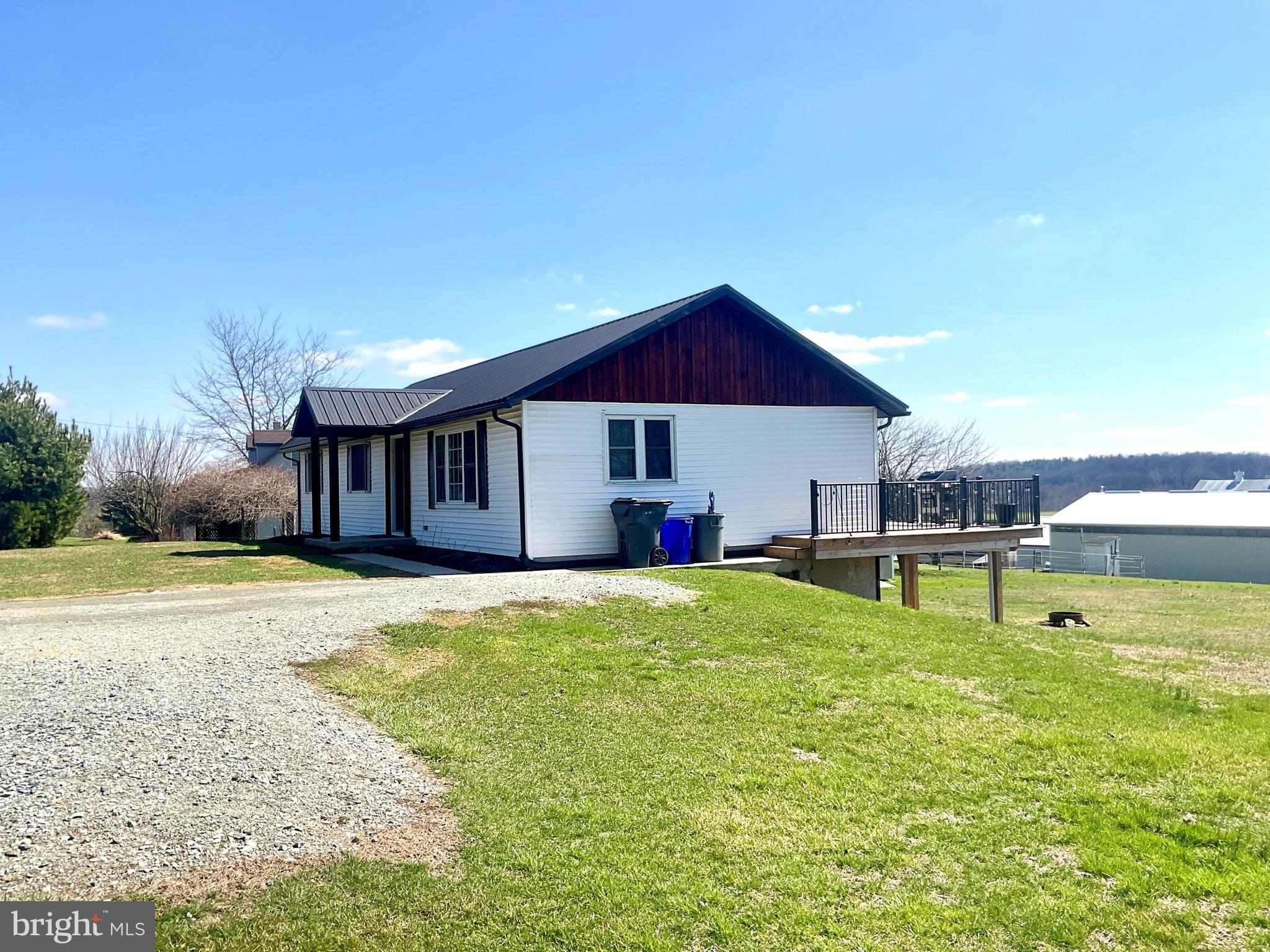 971 Dry Wells Road Quarryville, PA 17566 - Photo 2 of 37 a view of a house with a yard and sitting area