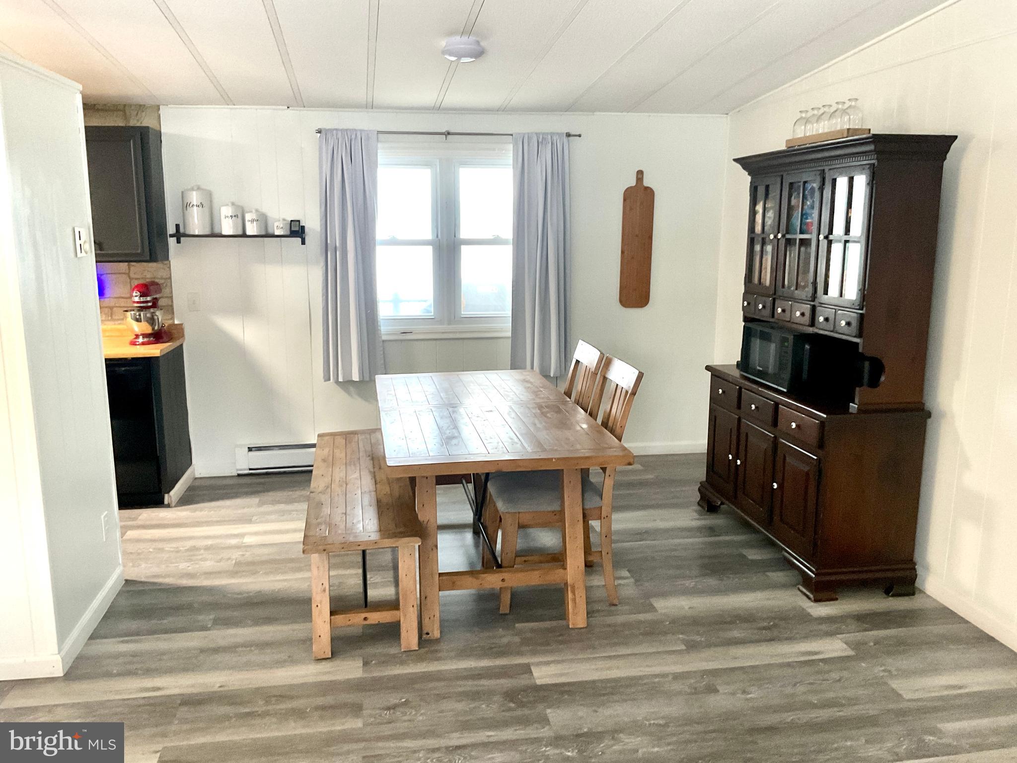 971 Dry Wells Road Quarryville, PA 17566 - Photo 21 of 37 a dining room with wooden floor and breakfast area