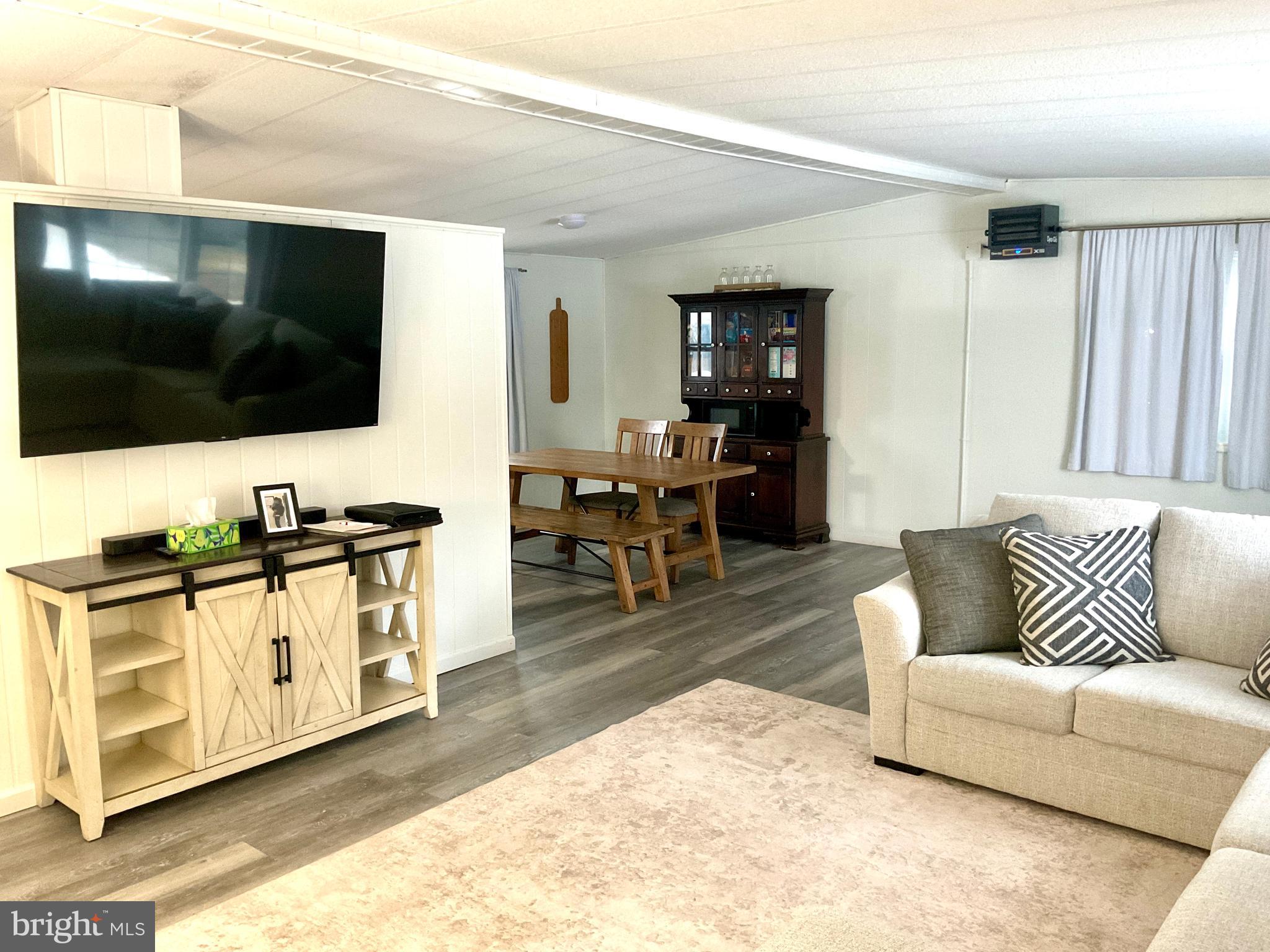 971 Dry Wells Road Quarryville, PA 17566 - Photo 24 of 37 a living room with furniture and a flat screen tv