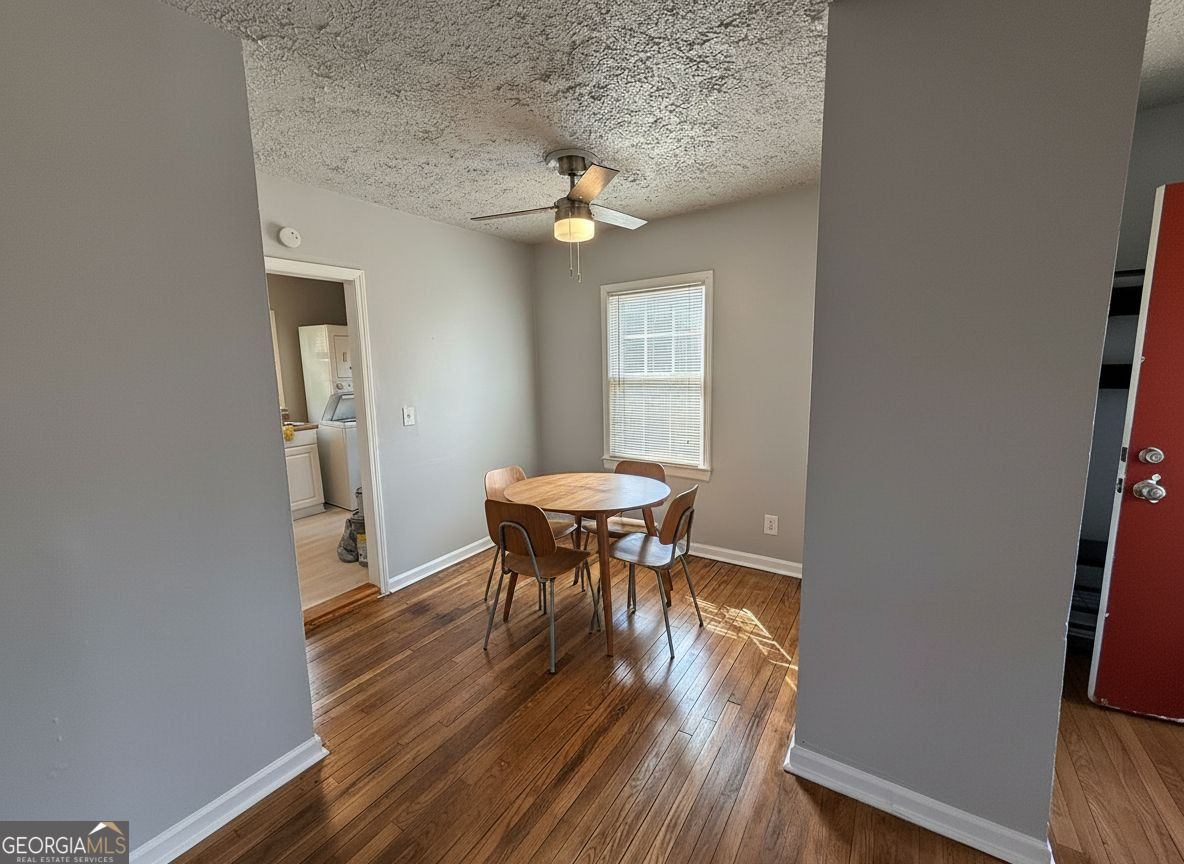 1624 Terry Mill Road Southeast Atlanta, GA 30316 - Photo 4 of 13 a view of a dining room with furniture and wooden floor