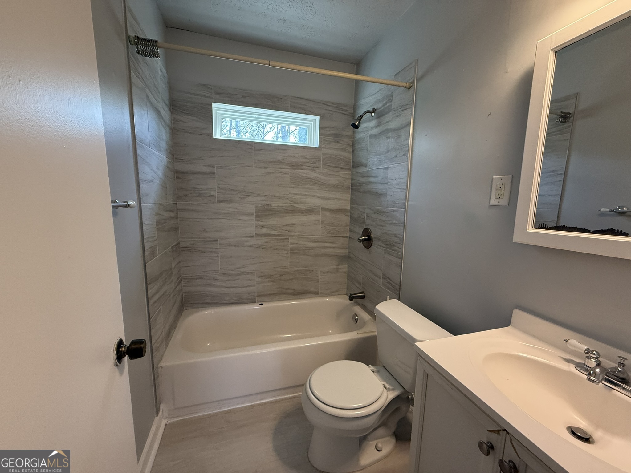 1624 Terry Mill Road Southeast Atlanta, GA 30316 - Photo 7 of 13 a bathroom with a sink and a bathtub