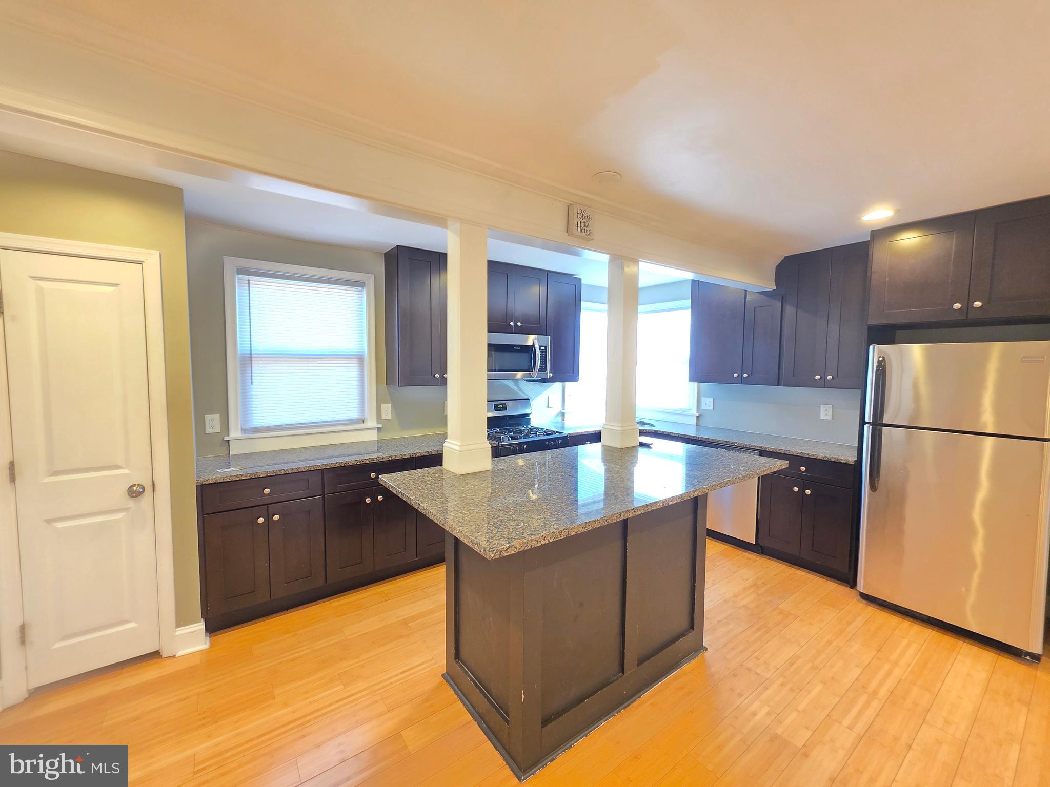 27 Goldy Drive Gloucester City, NJ 08030 - Photo 16 of 41 a kitchen with stainless steel appliances granite countertop a sink a refrigerator and a stove