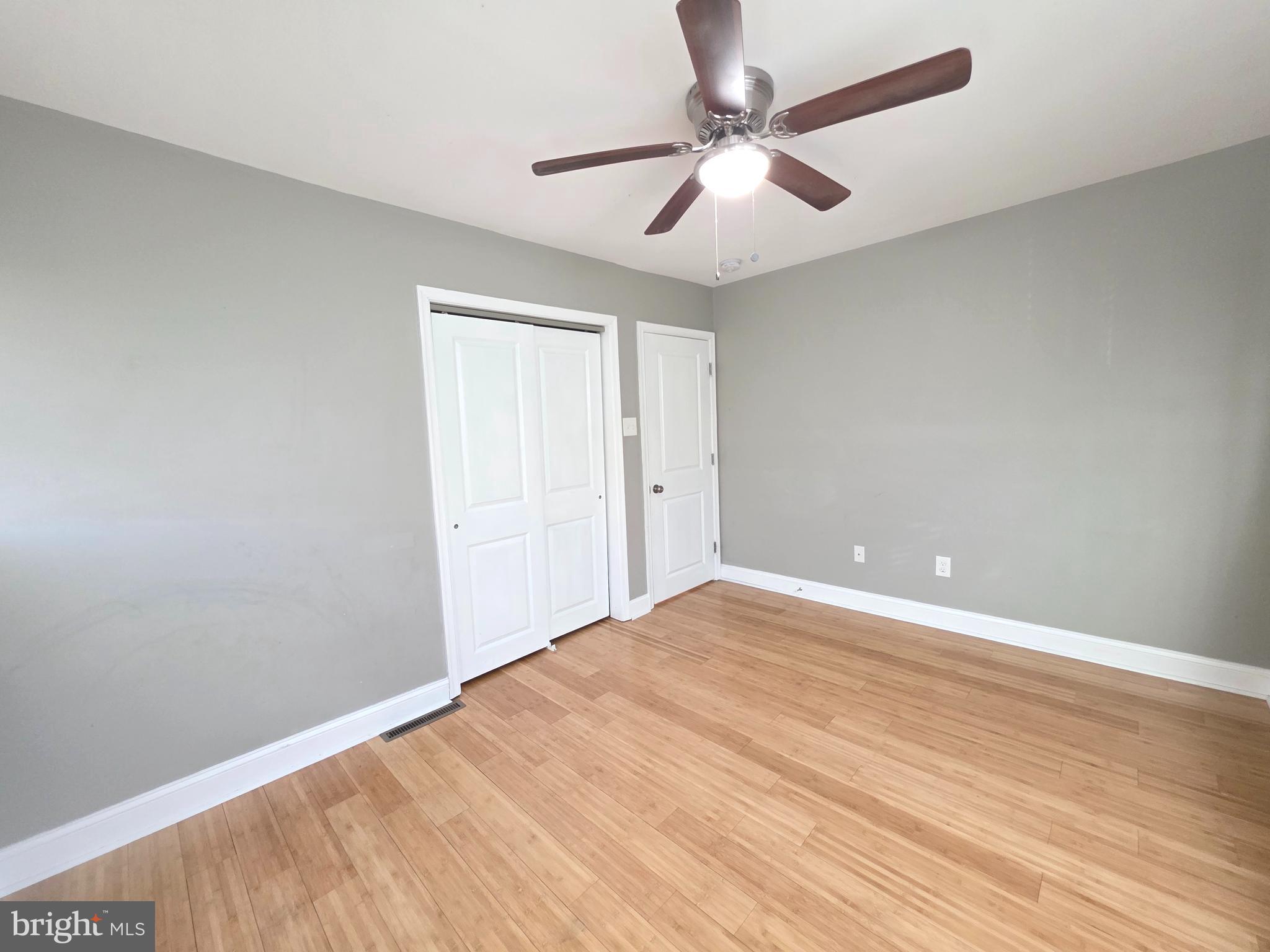 27 Goldy Drive Gloucester City, NJ 08030 - Photo 20 of 41 an empty room with wooden floor and windows
