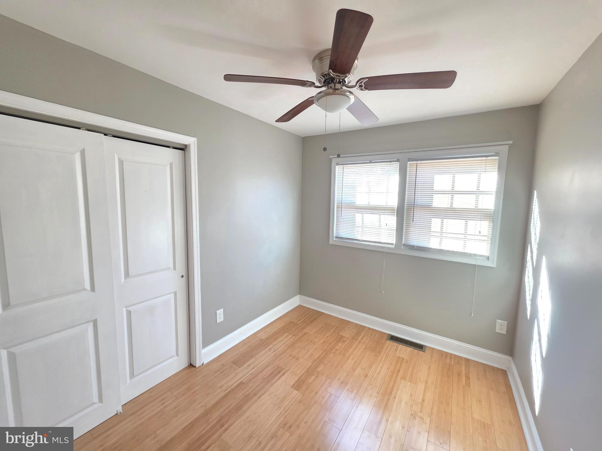 27 Goldy Drive Gloucester City, NJ 08030 - Photo 22 of 41 a view of empty room with wooden floor and fan