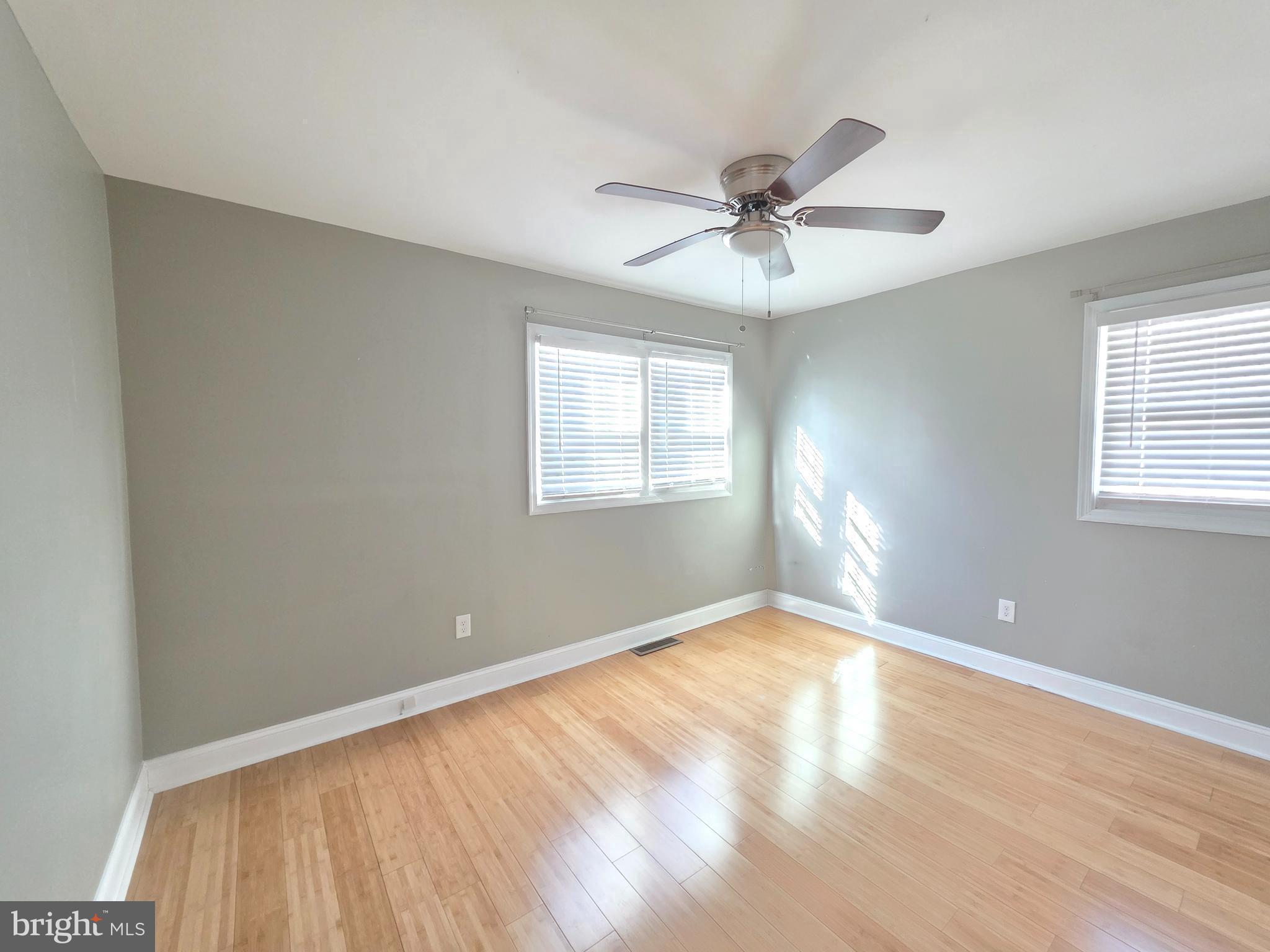27 Goldy Drive Gloucester City, NJ 08030 - Photo 23 of 41 a view of an empty room with window and wooden floor
