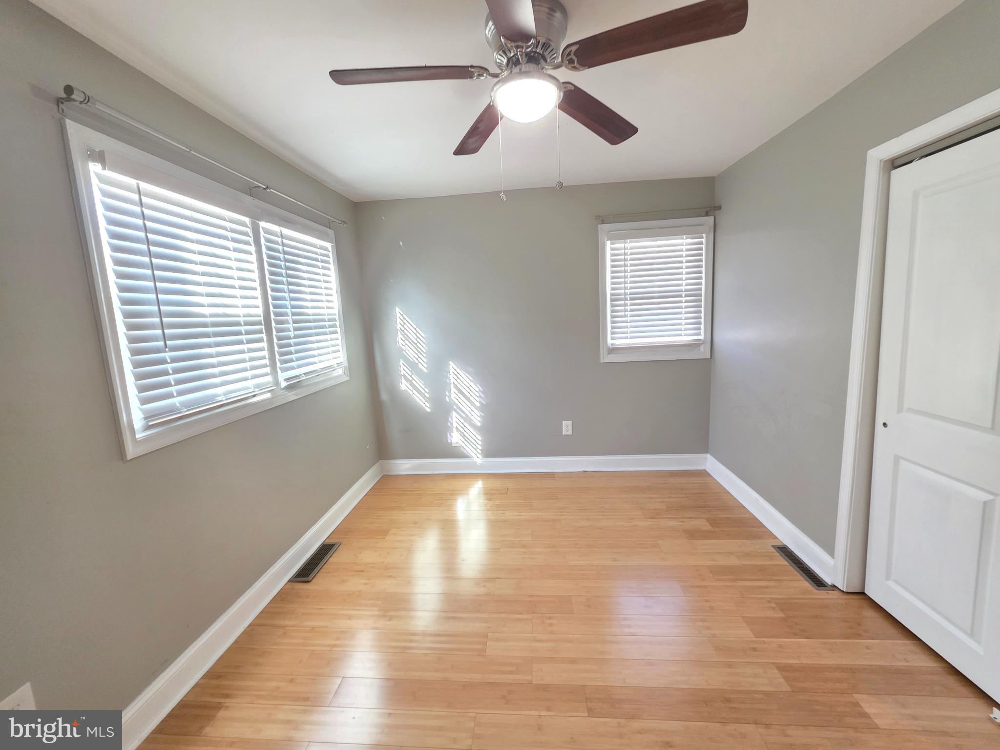 27 Goldy Drive Gloucester City, NJ 08030 - Photo 24 of 41 a view of an empty room with wooden floor and a window