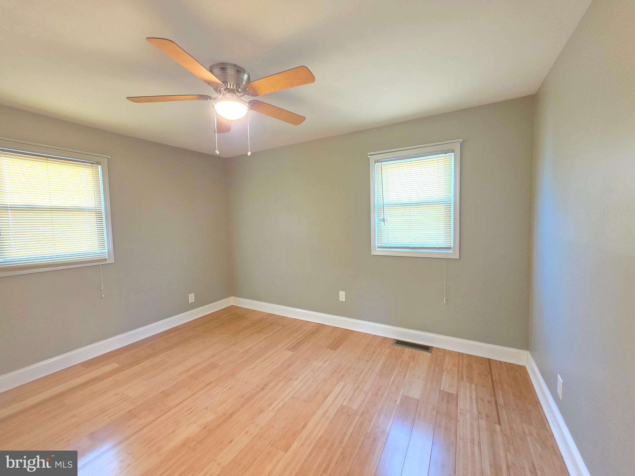 27 Goldy Drive Gloucester City, NJ 08030 - Photo 26 of 41 wooden floor in an empty room with a window