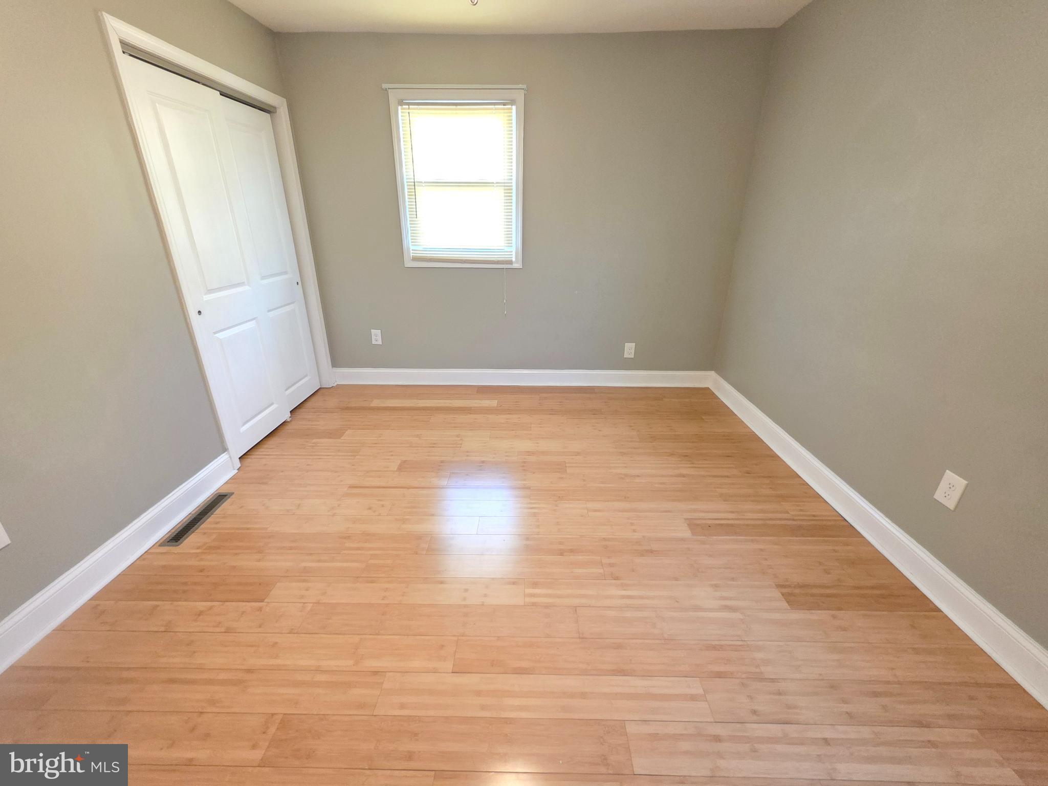 27 Goldy Drive Gloucester City, NJ 08030 - Photo 27 of 41 a view of an empty room with wooden floor and a window