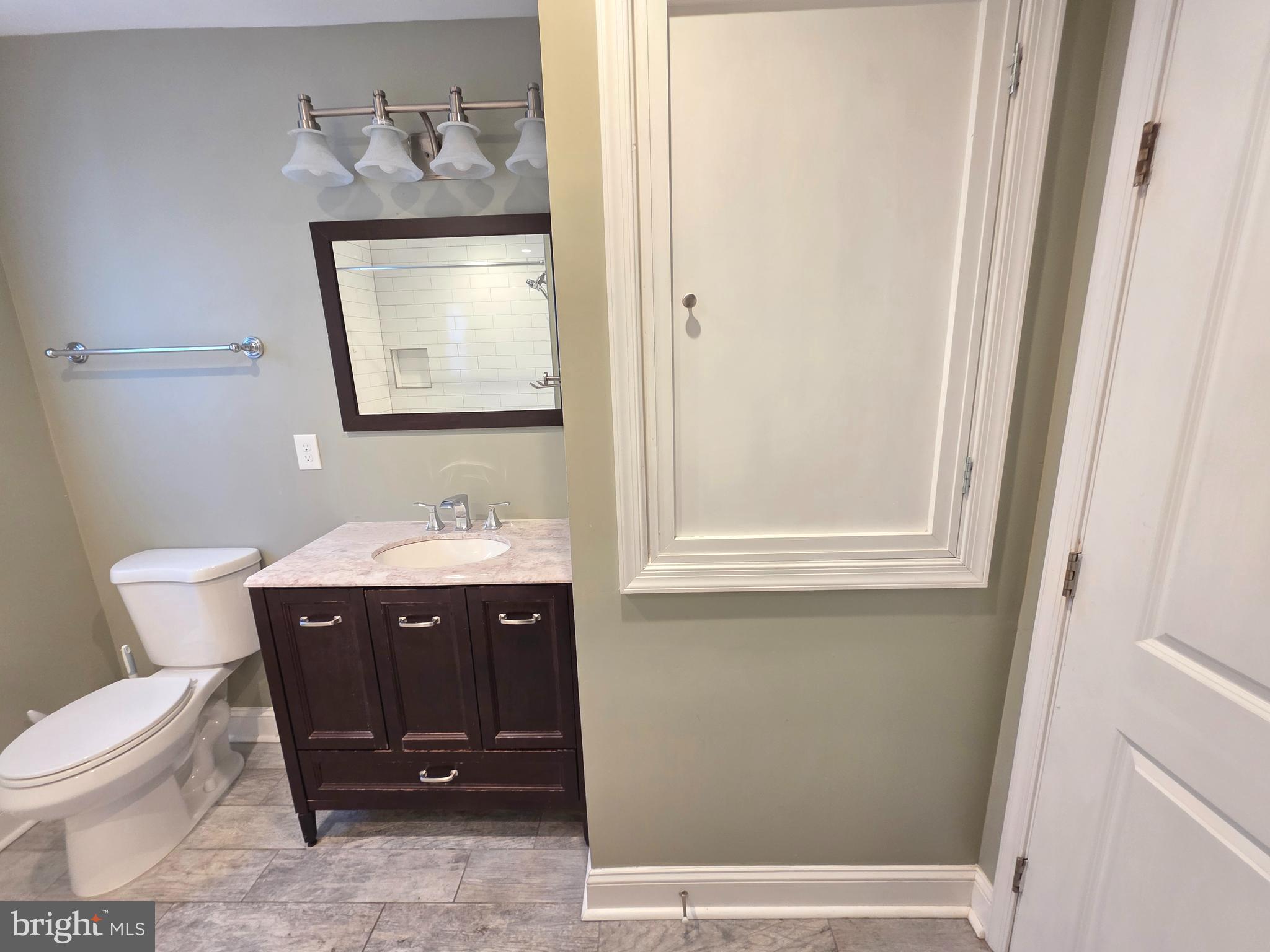27 Goldy Drive Gloucester City, NJ 08030 - Photo 29 of 41 a bathroom with a sink mirror and toilet