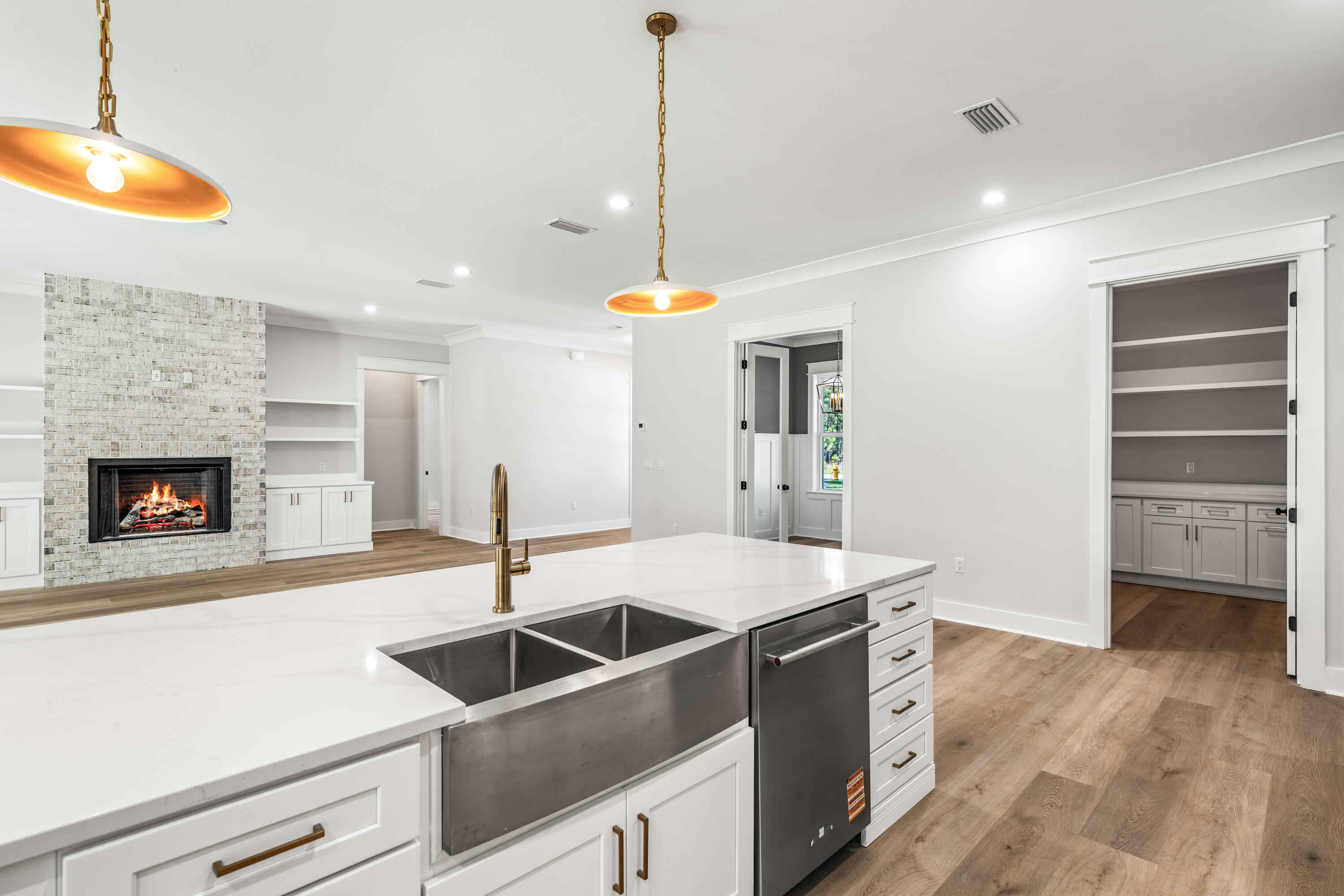 112 East Captain Fritz Way Freeport, FL 32439 - Photo 13 of 114 a kitchen with a sink a stove and a refrigerator
