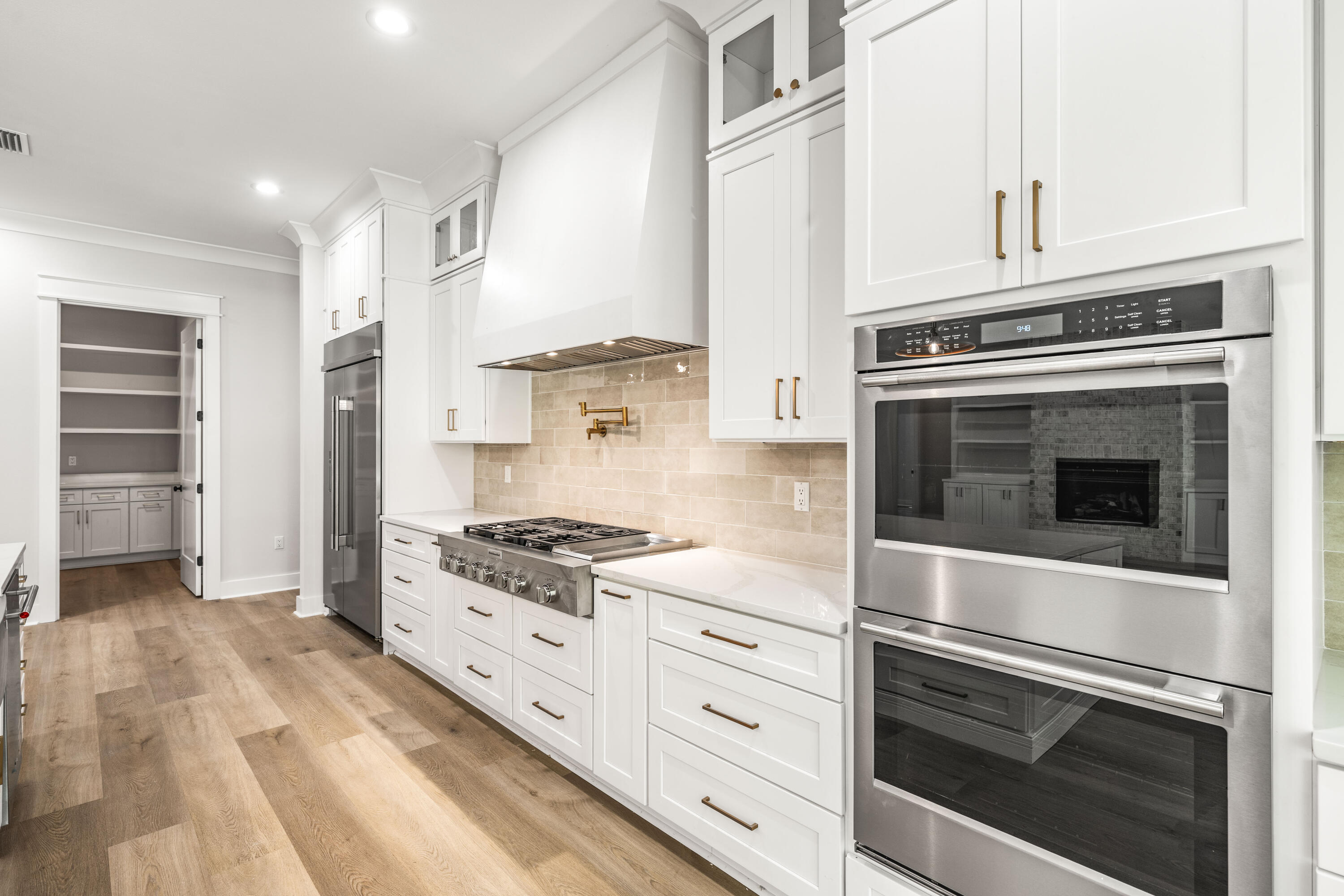 112 East Captain Fritz Way Freeport, FL 32439 - Photo 15 of 114 a kitchen with stainless steel appliances granite countertop a stove and a refrigerator