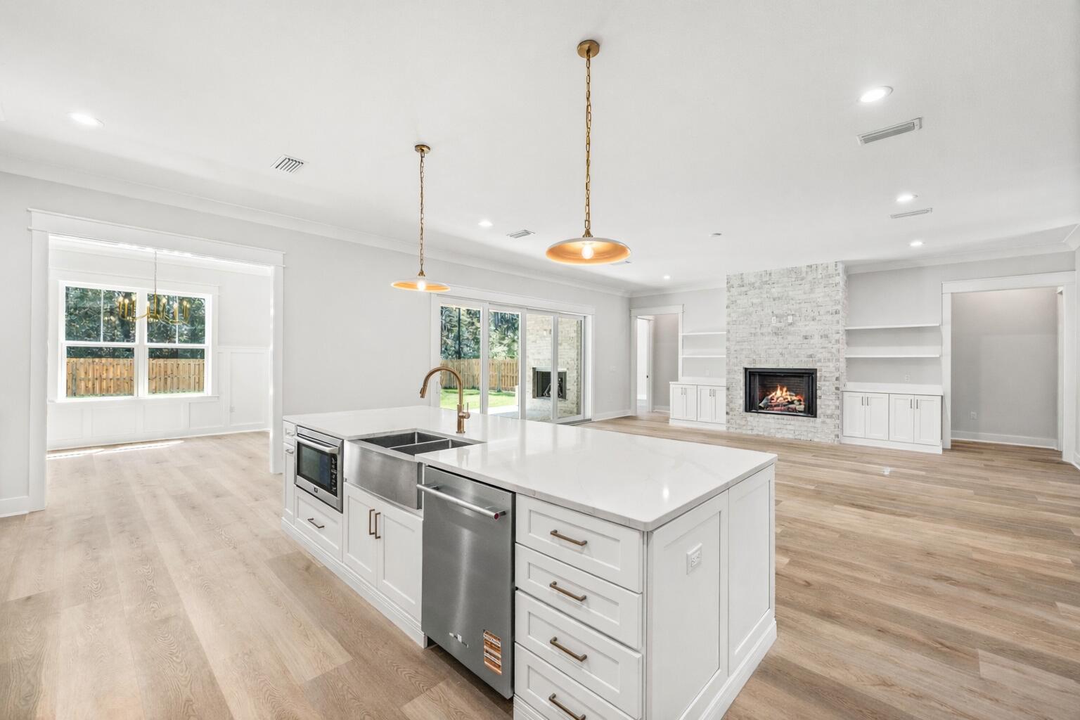 112 East Captain Fritz Way Freeport, FL 32439 - Photo 16 of 114 a open kitchen with stainless steel appliances granite countertop a stove and kitchen island