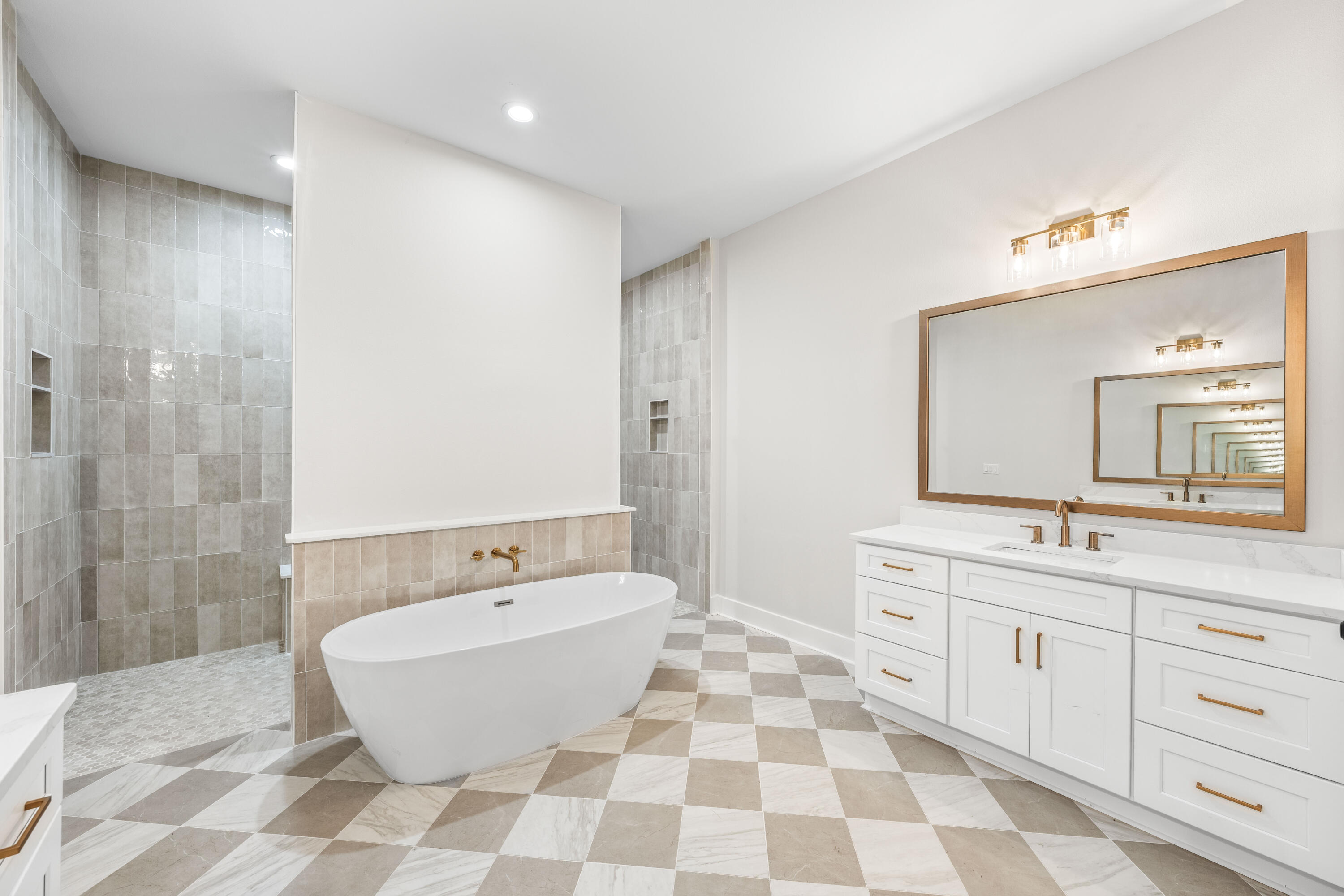 112 East Captain Fritz Way Freeport, FL 32439 - Photo 24 of 114 a spacious bathroom with a bathtub sink and mirror