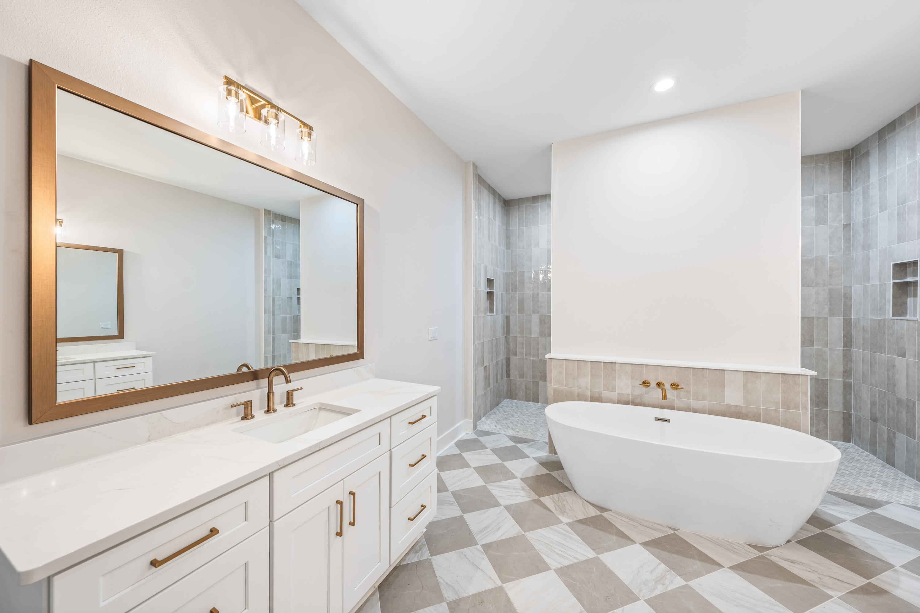 112 East Captain Fritz Way Freeport, FL 32439 - Photo 25 of 114 a spacious bathroom with a double vanity sink mirror and bathtub