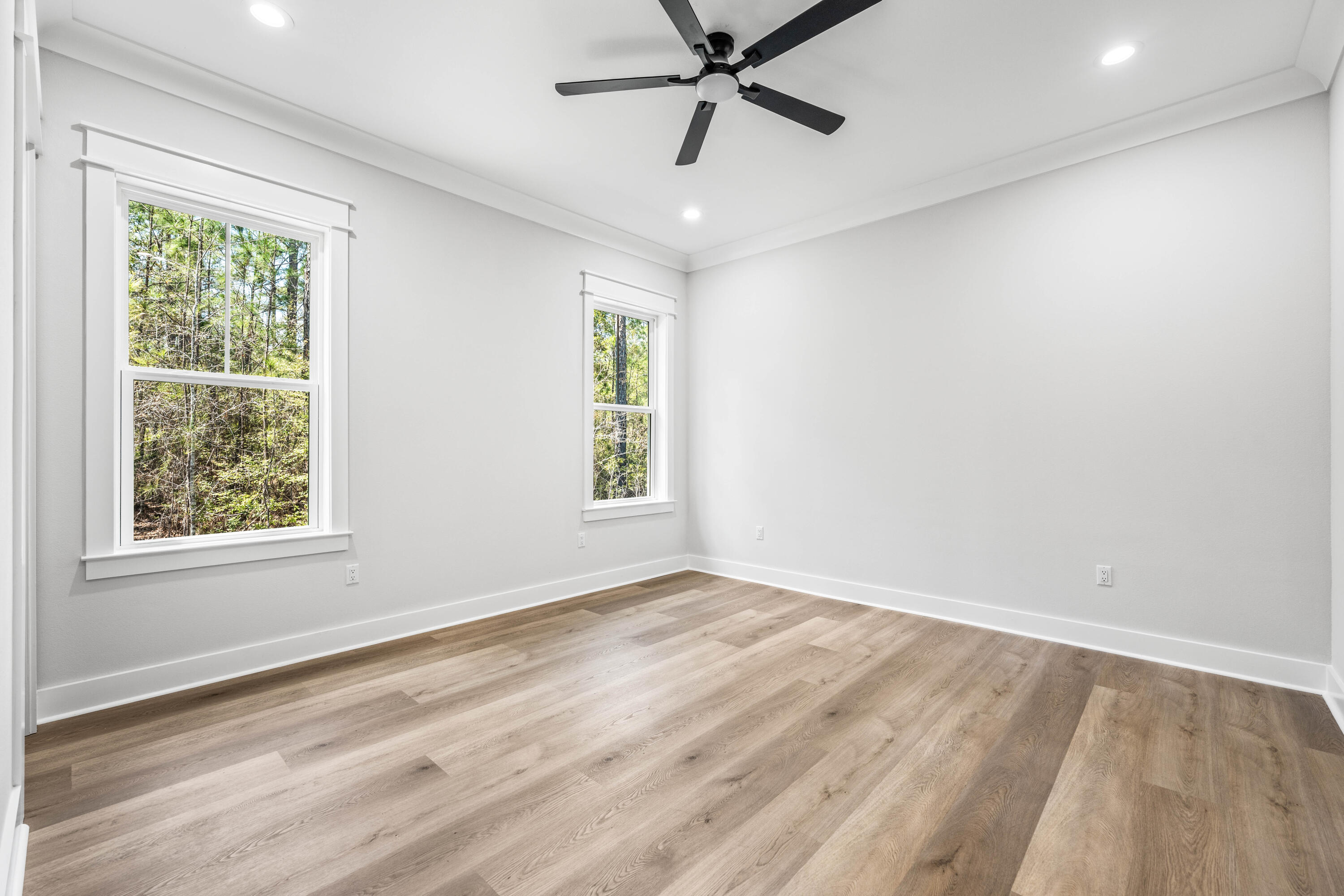 112 East Captain Fritz Way Freeport, FL 32439 - Photo 34 of 114 wooden floor in an empty room with a window
