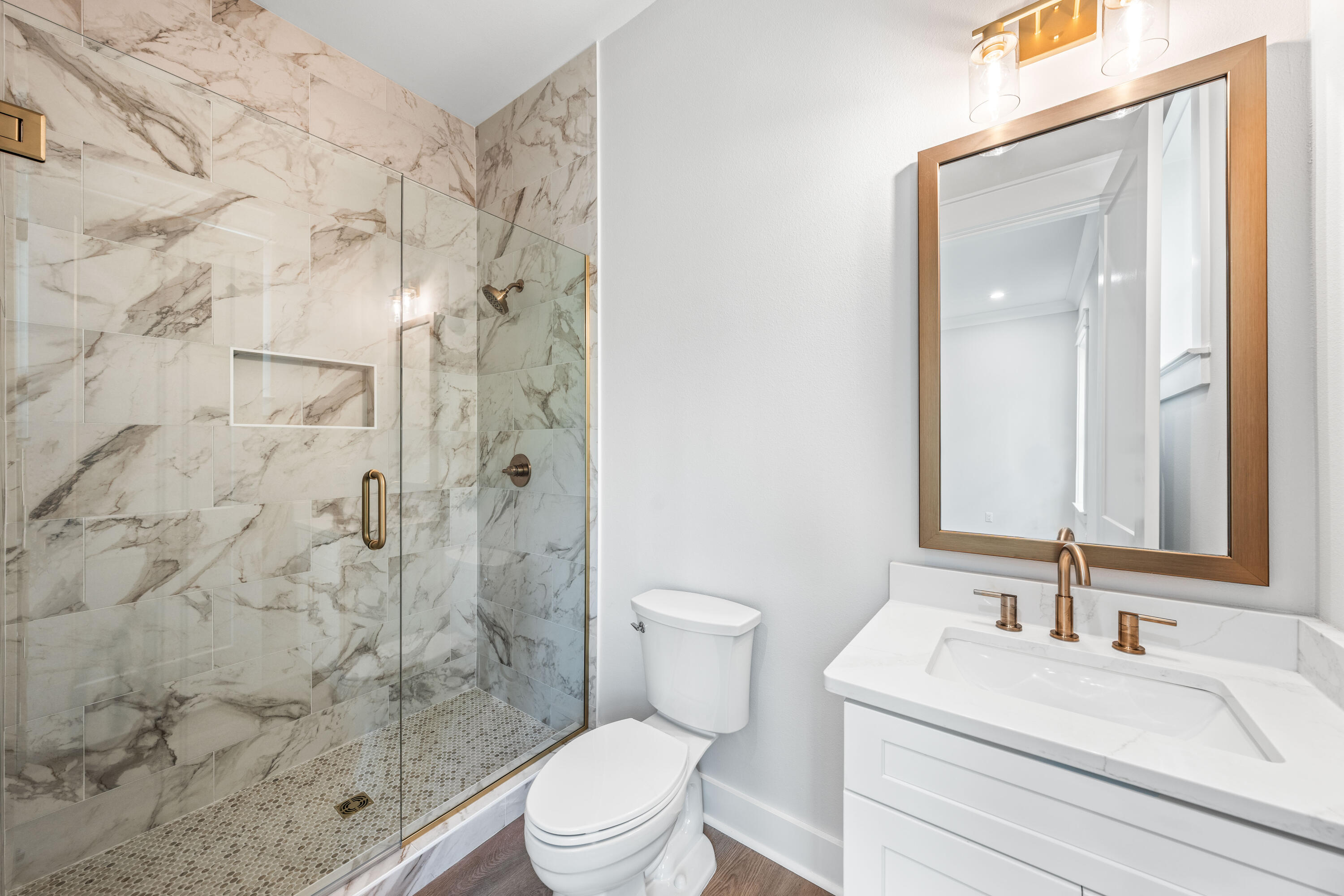 112 East Captain Fritz Way Freeport, FL 32439 - Photo 36 of 114 a bathroom with a sink a toilet and shower