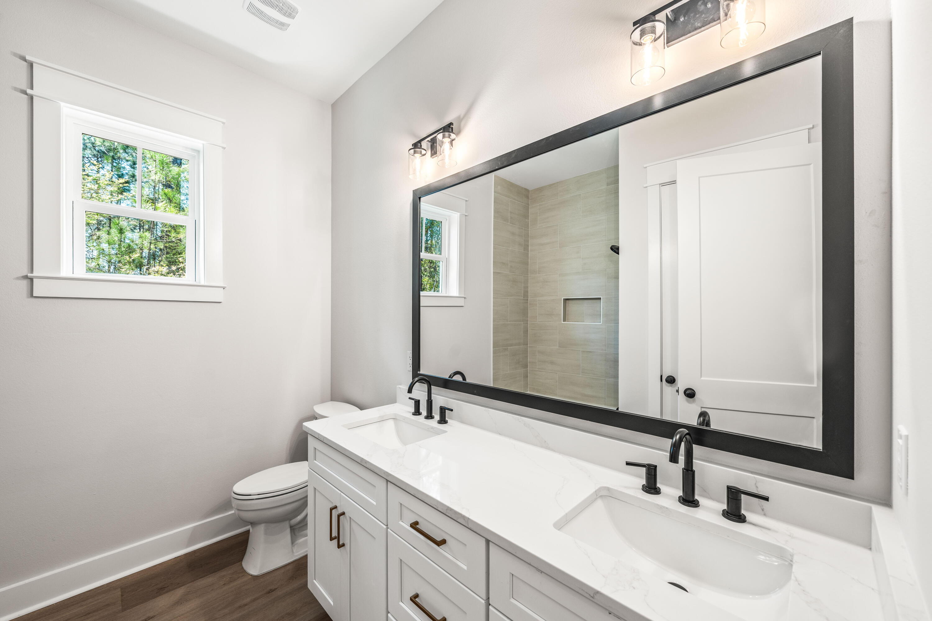 112 East Captain Fritz Way Freeport, FL 32439 - Photo 41 of 114 a bathroom with a double vanity sink and a mirror