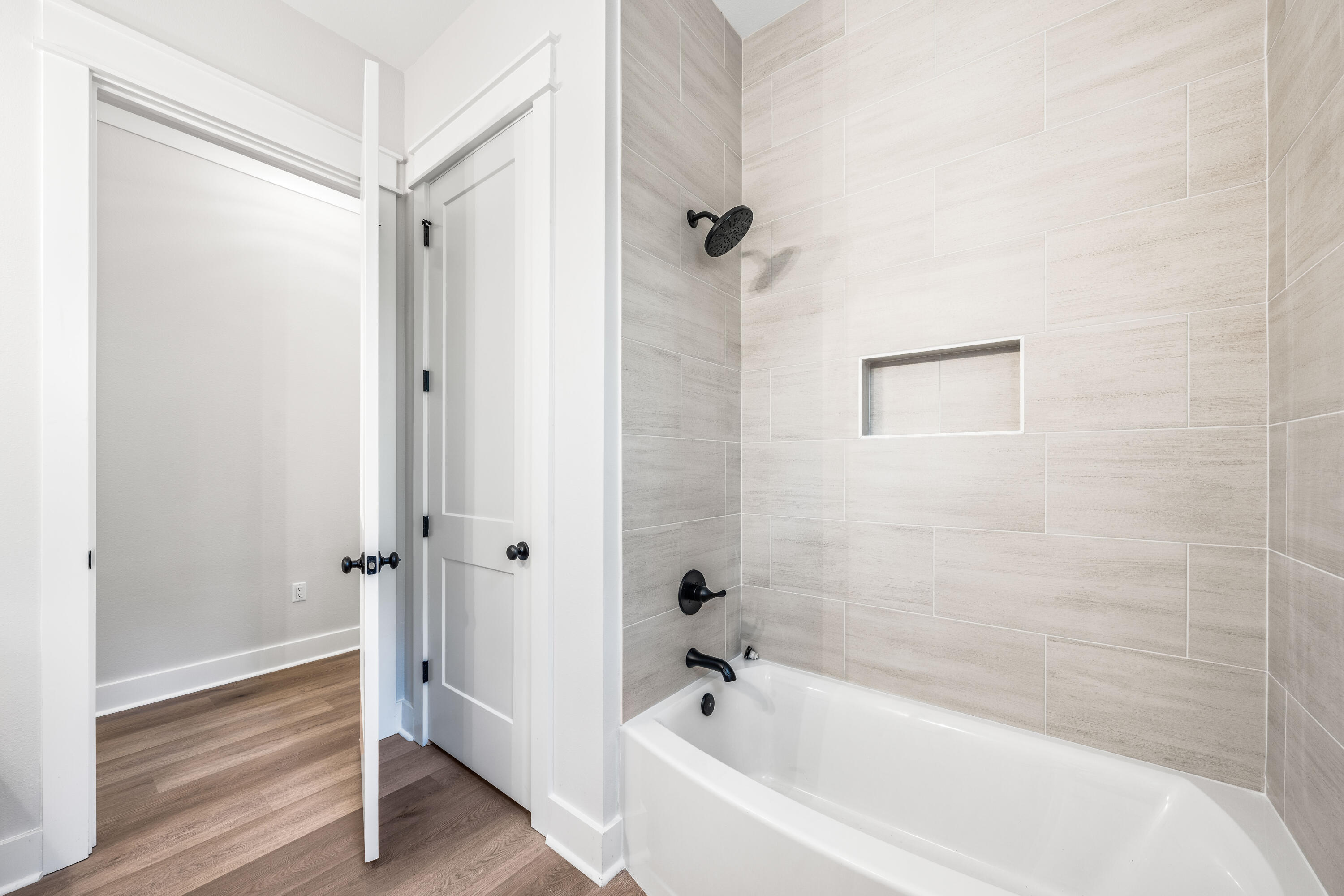 112 East Captain Fritz Way Freeport, FL 32439 - Photo 42 of 114 a bathroom with a bathtub and a shower