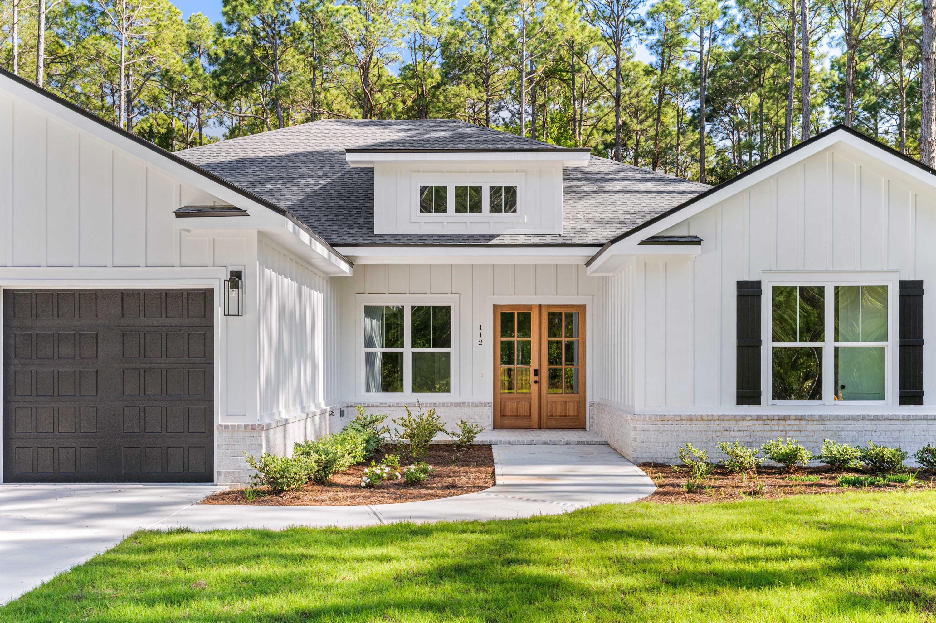 112 East Captain Fritz Way Freeport, FL 32439 - Photo 53 of 114 a front view of a house with a yard