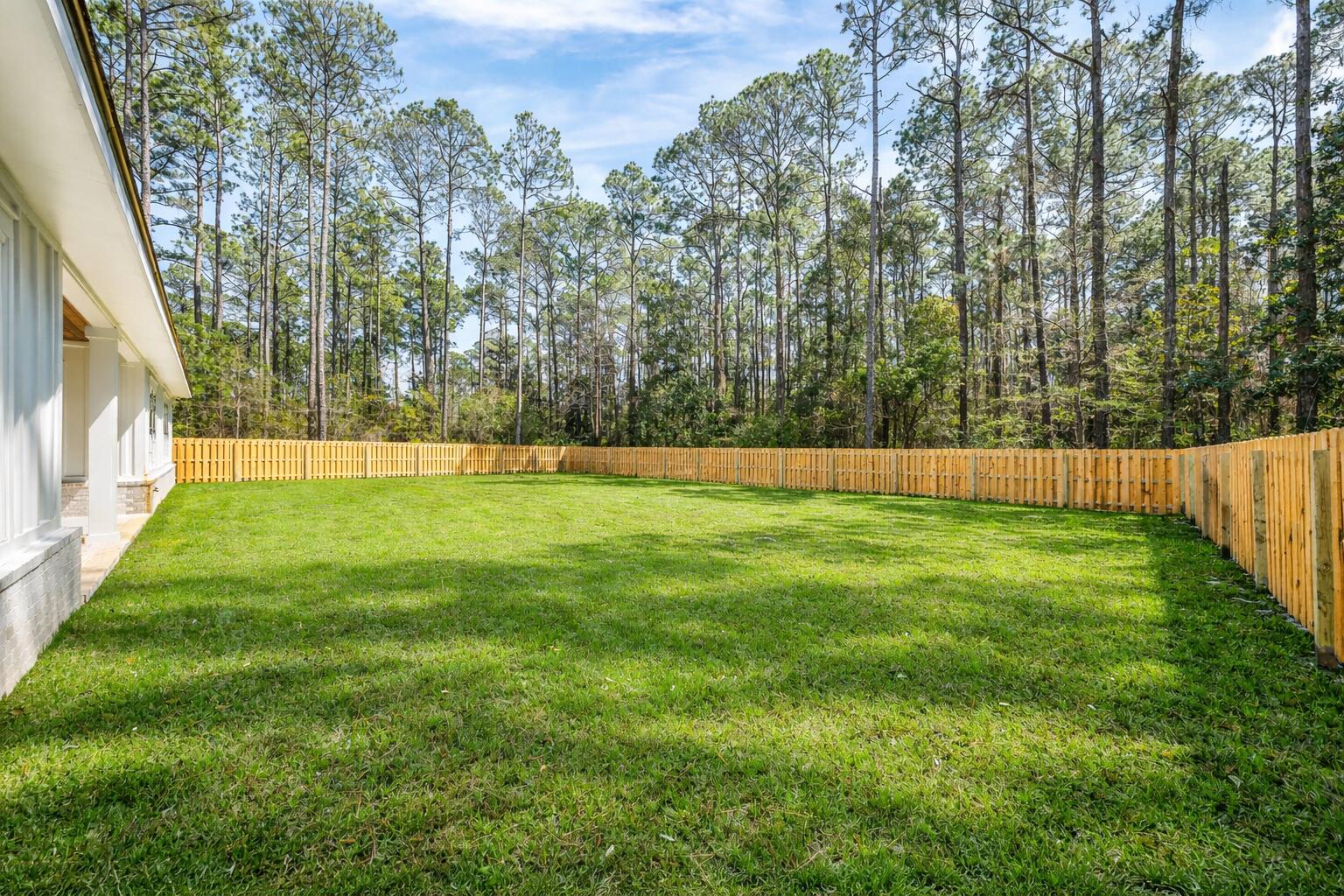 112 East Captain Fritz Way Freeport, FL 32439 - Photo 59 of 114 a view of yard with trees in the background