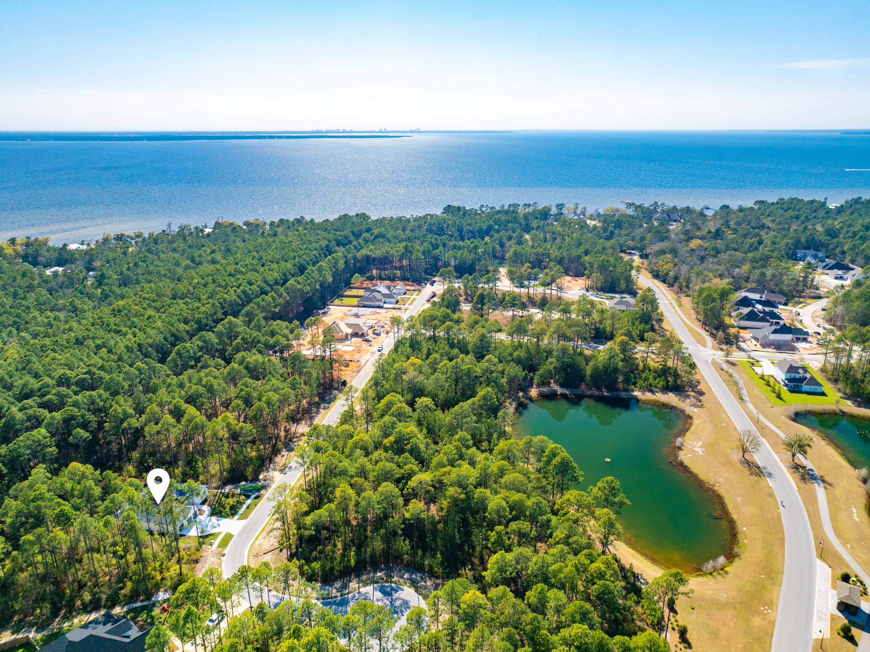 112 East Captain Fritz Way Freeport, FL 32439 - Photo 69 of 114 an aerial view of a city with lots of residential buildings ocean and mountain view in back