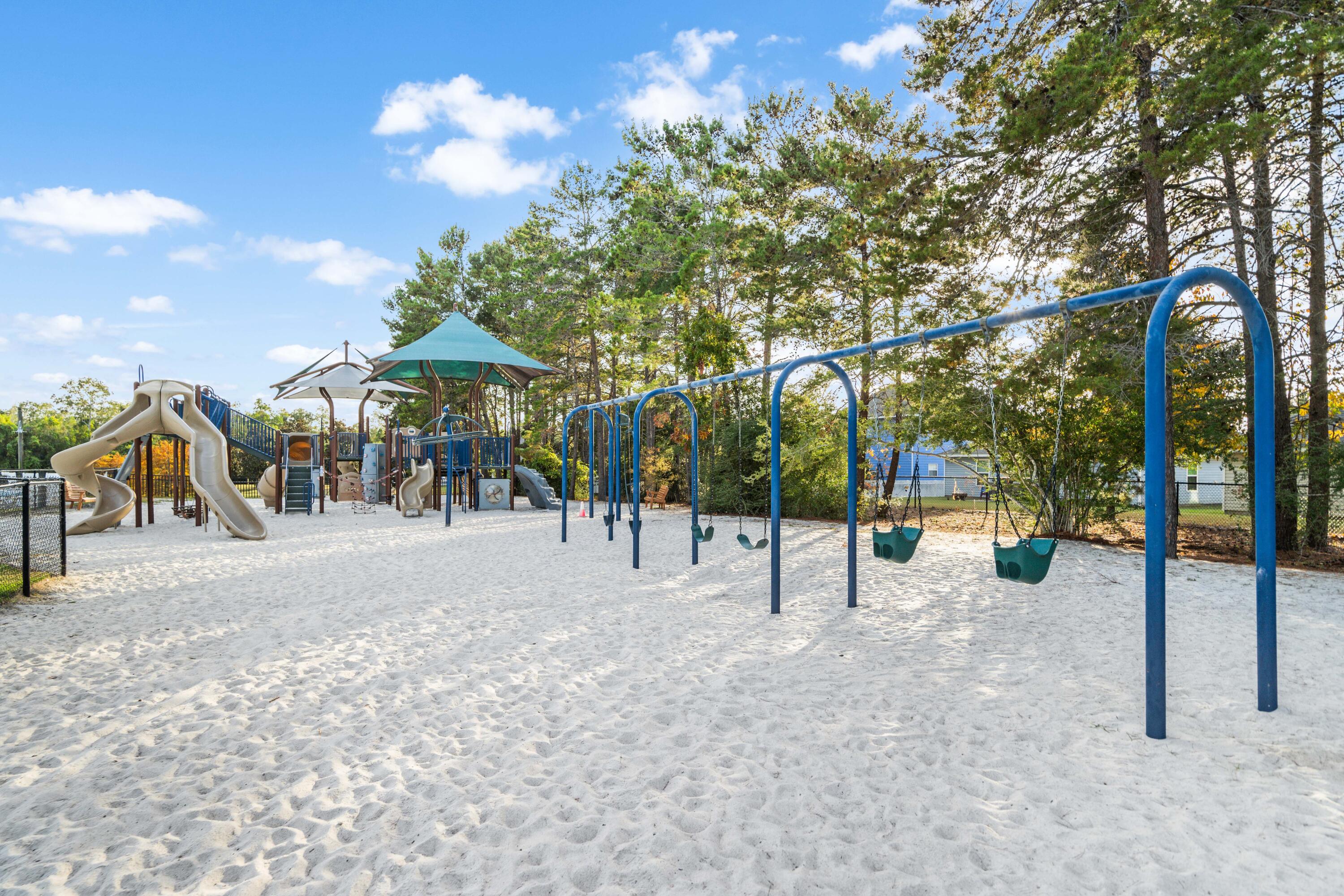 112 East Captain Fritz Way Freeport, FL 32439 - Photo 96 of 114 a view of a park with swings and slides