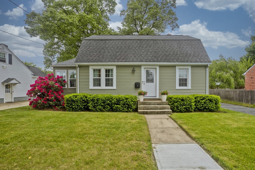 front view of a house and a yard