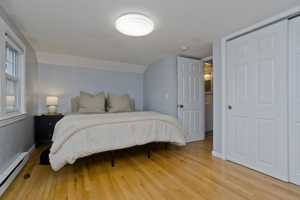 52 Gillette Circle Springfield, MA 01118 - Photo 18 of 30 a bedroom with a bed and wooden floor