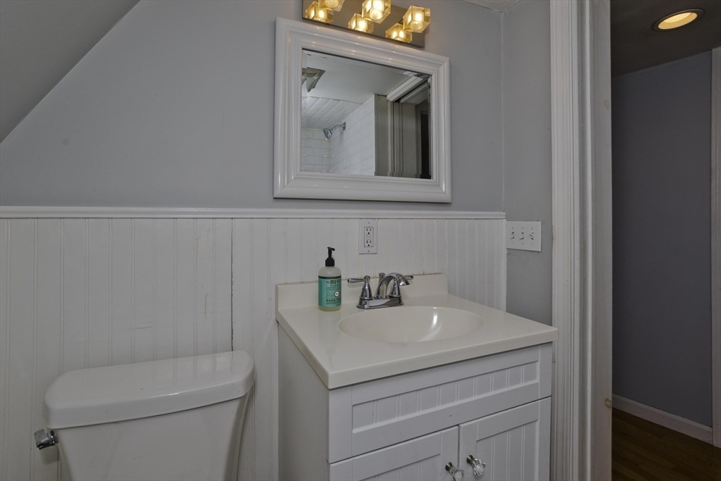 52 Gillette Circle Springfield, MA 01118 - Photo 20 of 30 a bathroom with a toilet sink and mirror