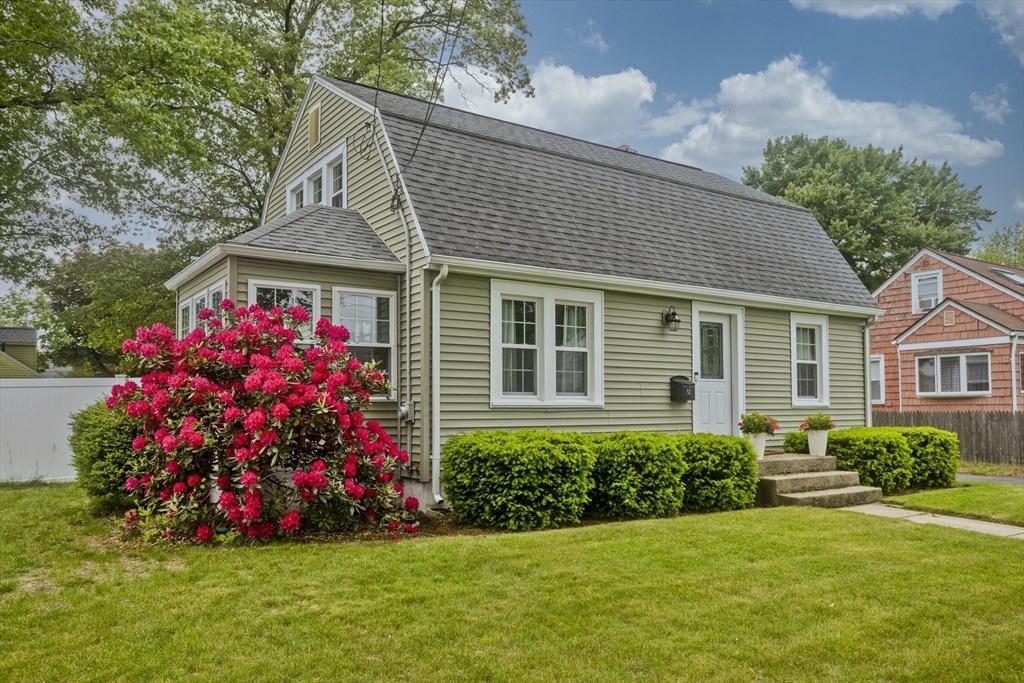 52 Gillette Circle Springfield, MA 01118 - Photo 2 of 30 a front view of a house with a yard and fountain