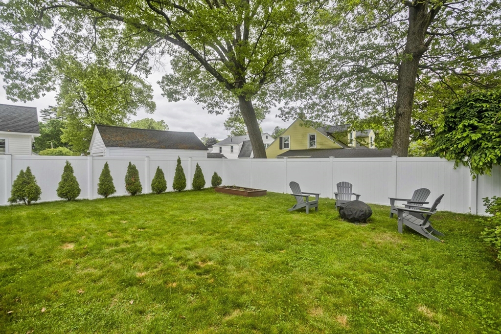 52 Gillette Circle Springfield, MA 01118 - Photo 27 of 30 a view of backyard with outdoor seating and green space