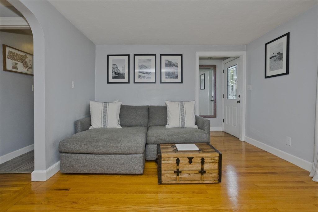 52 Gillette Circle Springfield, MA 01118 - Photo 4 of 30 a living room with furniture and a wooden floor