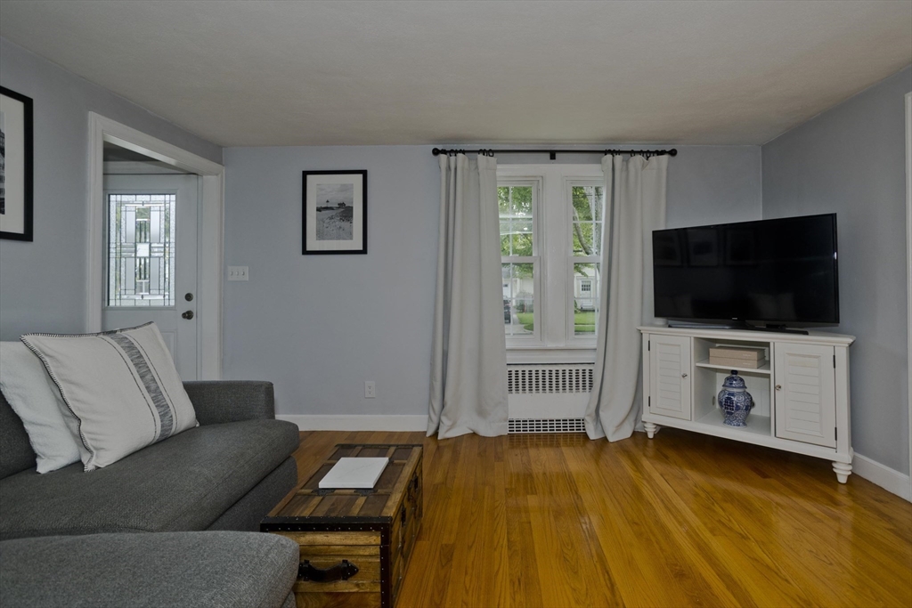 52 Gillette Circle Springfield, MA 01118 - Photo 5 of 30 a living room with furniture and a flat screen tv