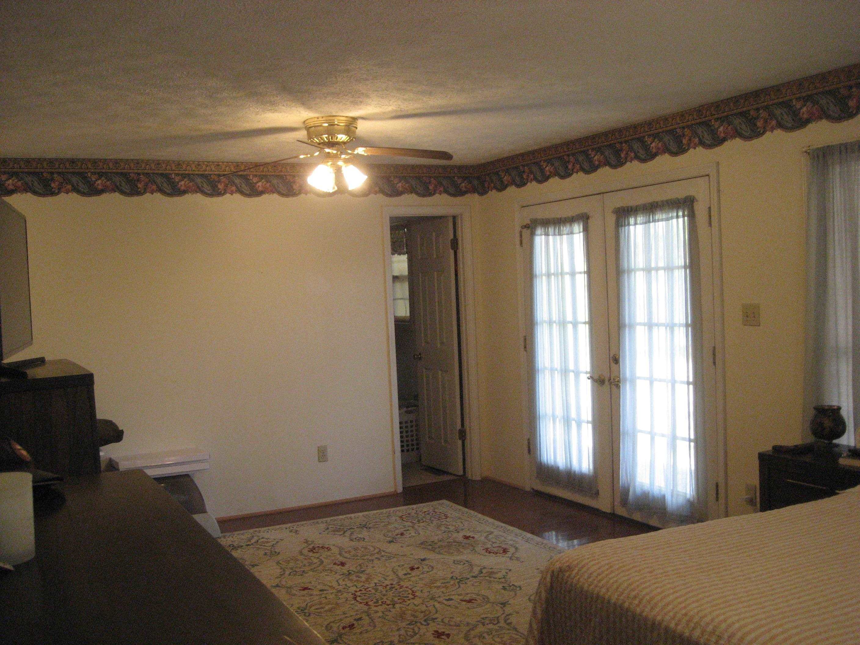1130 Seaton Loop Adamsville, TN 38310 - Photo 11 of 24 a bedroom with a bed and a window
