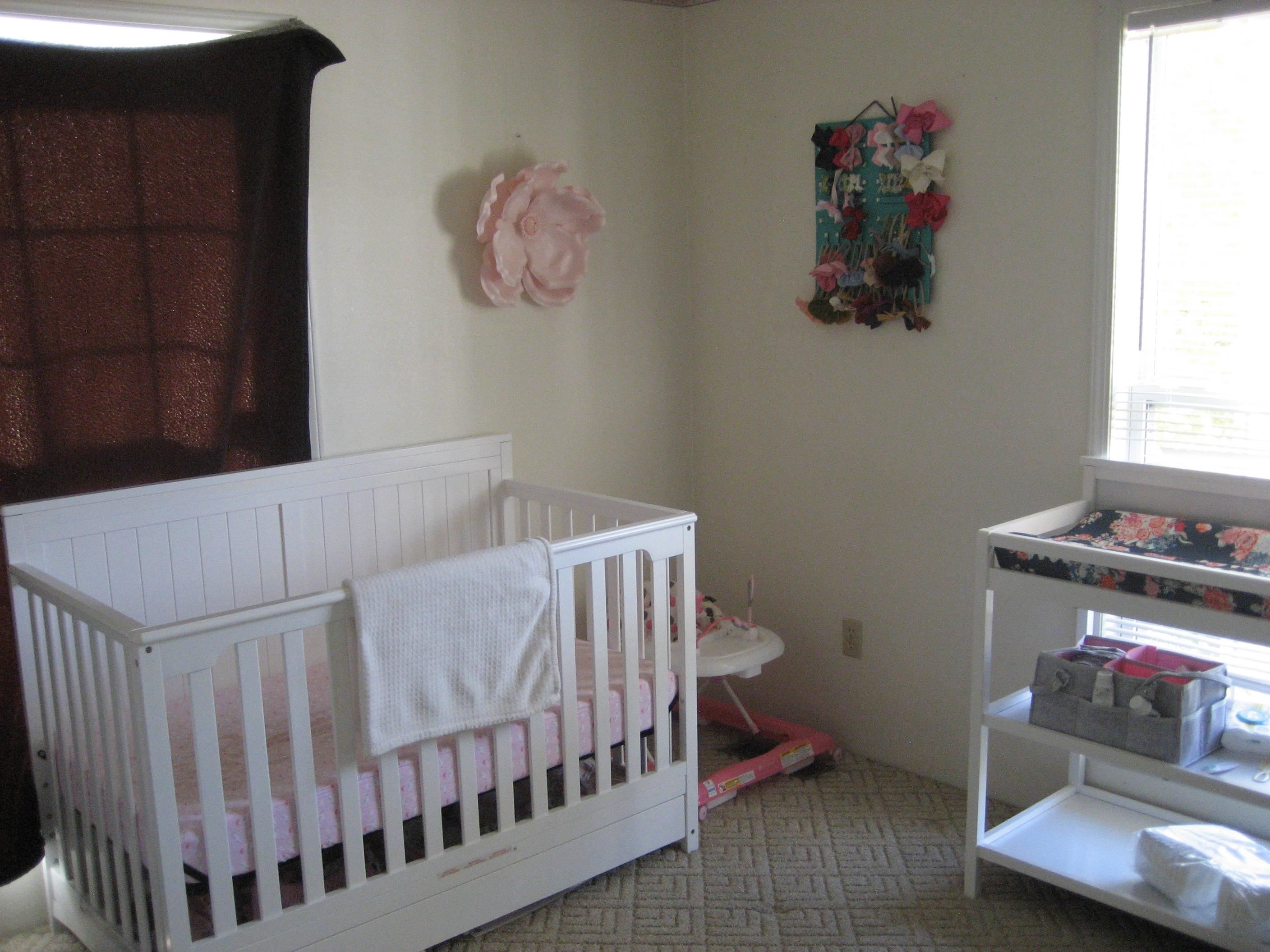 1130 Seaton Loop Adamsville, TN 38310 - Photo 15 of 24 a bedroom with a bed and wooden floor
