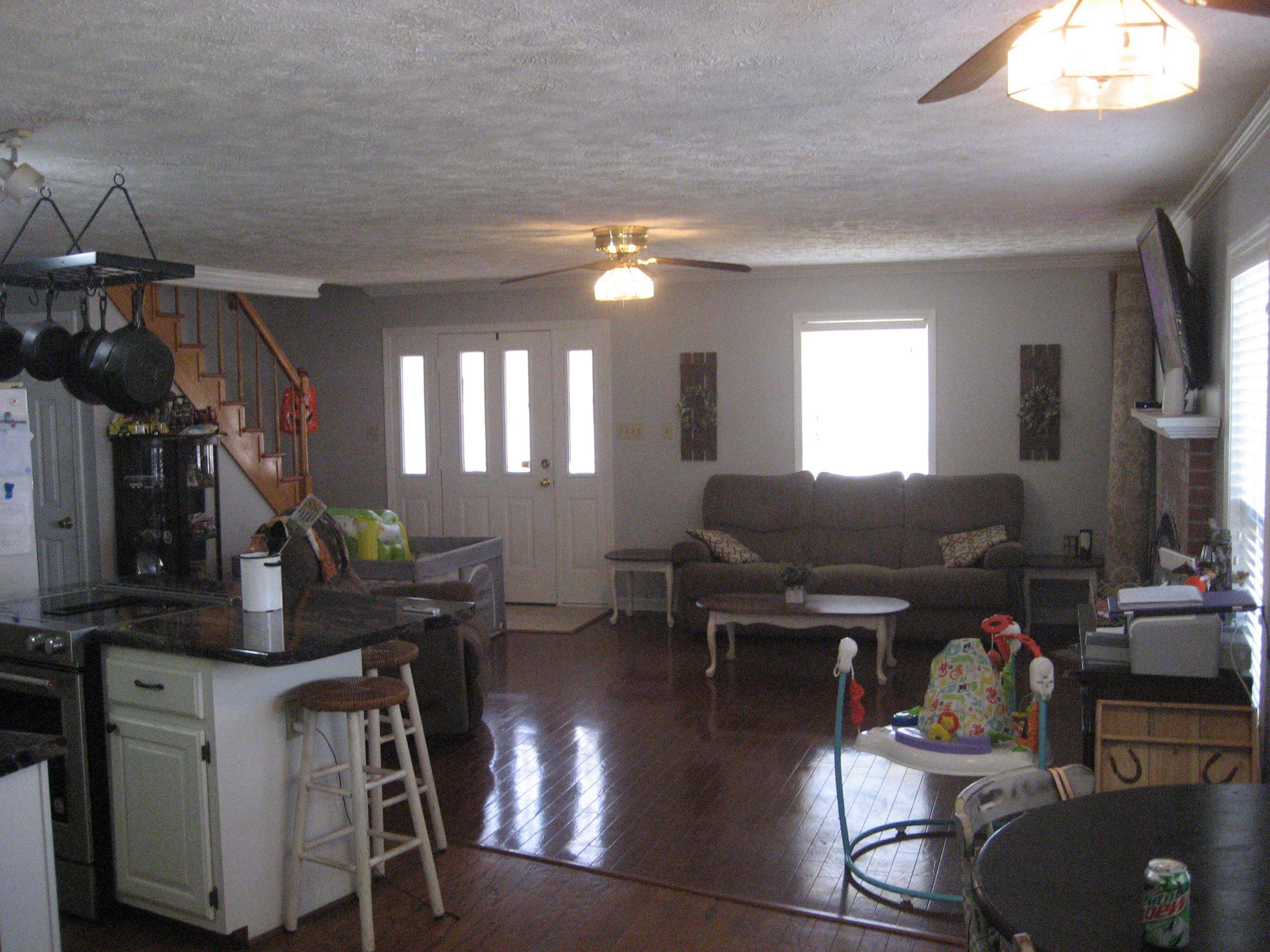 1130 Seaton Loop Adamsville, TN 38310 - Photo 3 of 24 a view of a livingroom with furniture and a chandelier