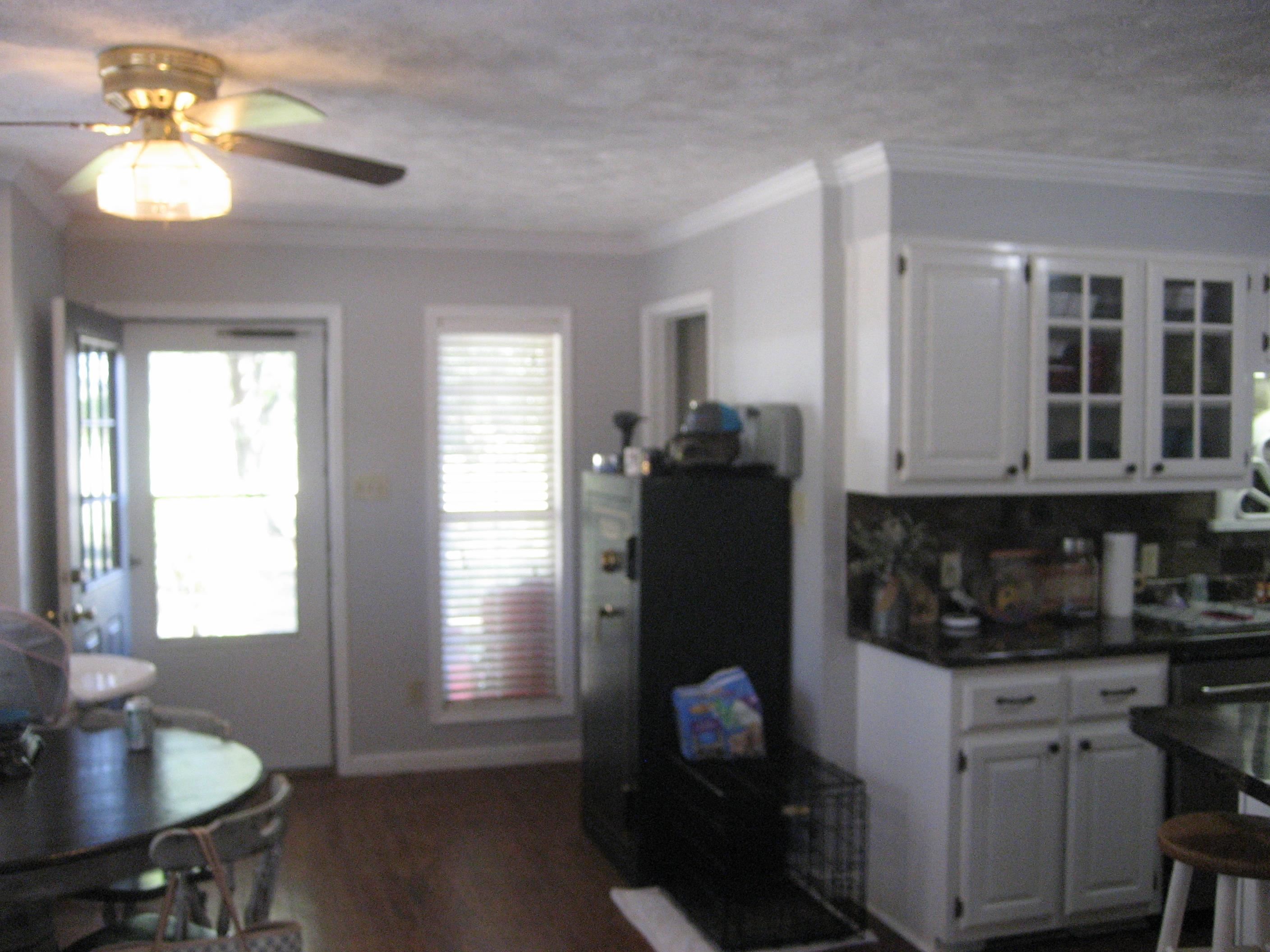 1130 Seaton Loop Adamsville, TN 38310 - Photo 5 of 24 a kitchen with a refrigerator and a sink