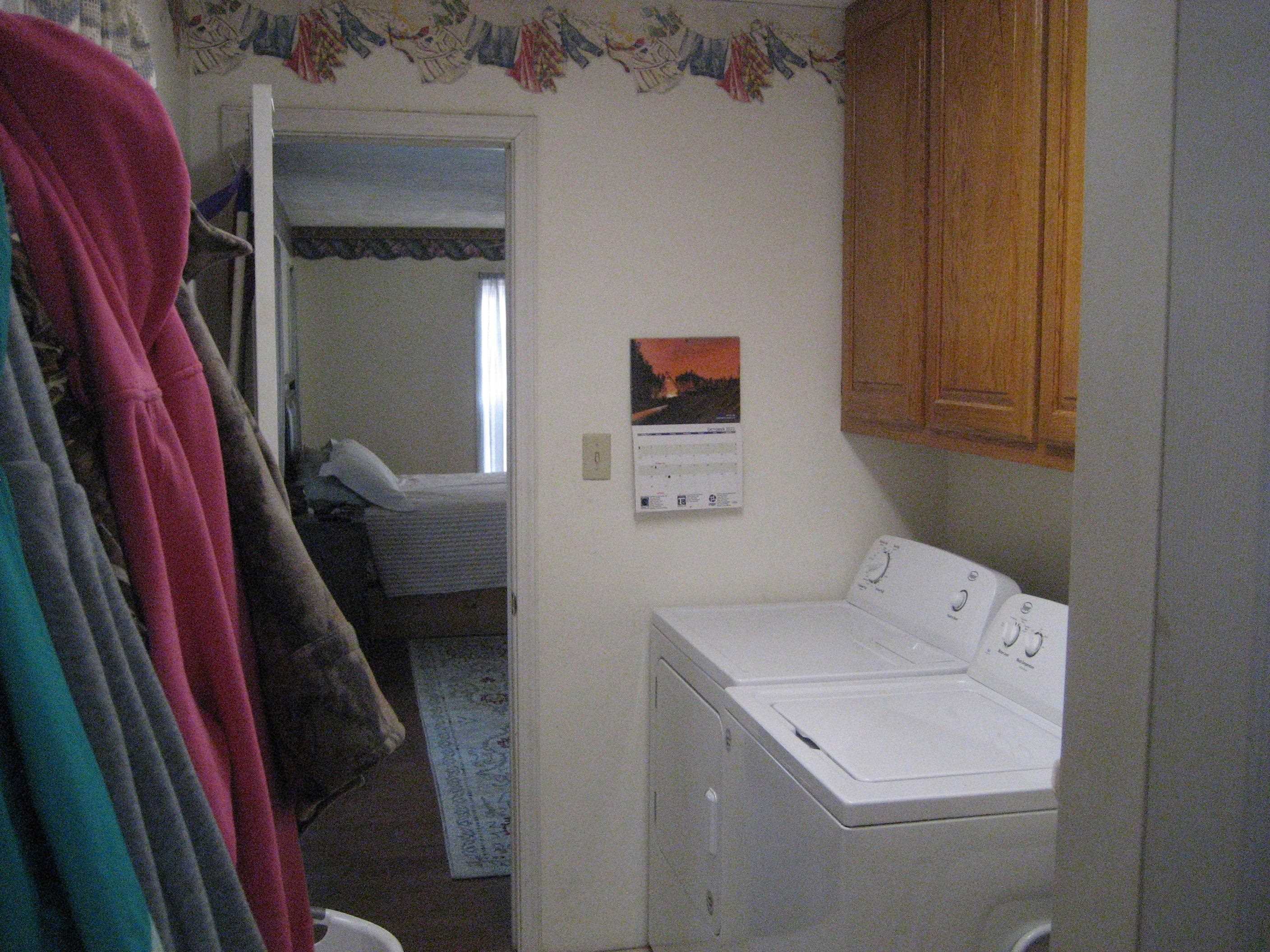 1130 Seaton Loop Adamsville, TN 38310 - Photo 9 of 24 a utility room with dryer and washer