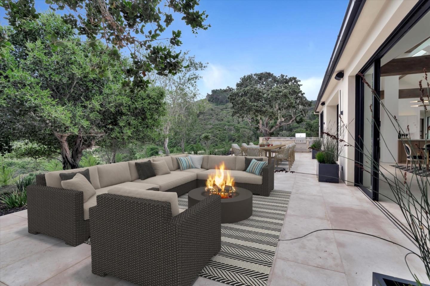 8140 Manjares Road Monterey, CA 93940 - Photo 17 of 20 a view of a patio with couches and a table and chairs with wooden floor and fence