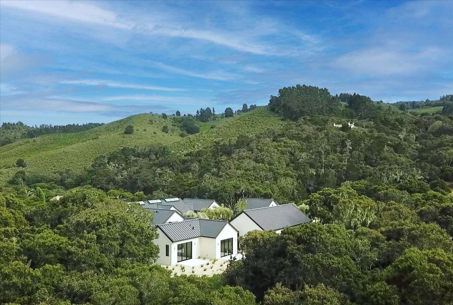 8140 Manjares Road Monterey, CA 93940 - Photo 4 of 20 a view of a city with lush green forest