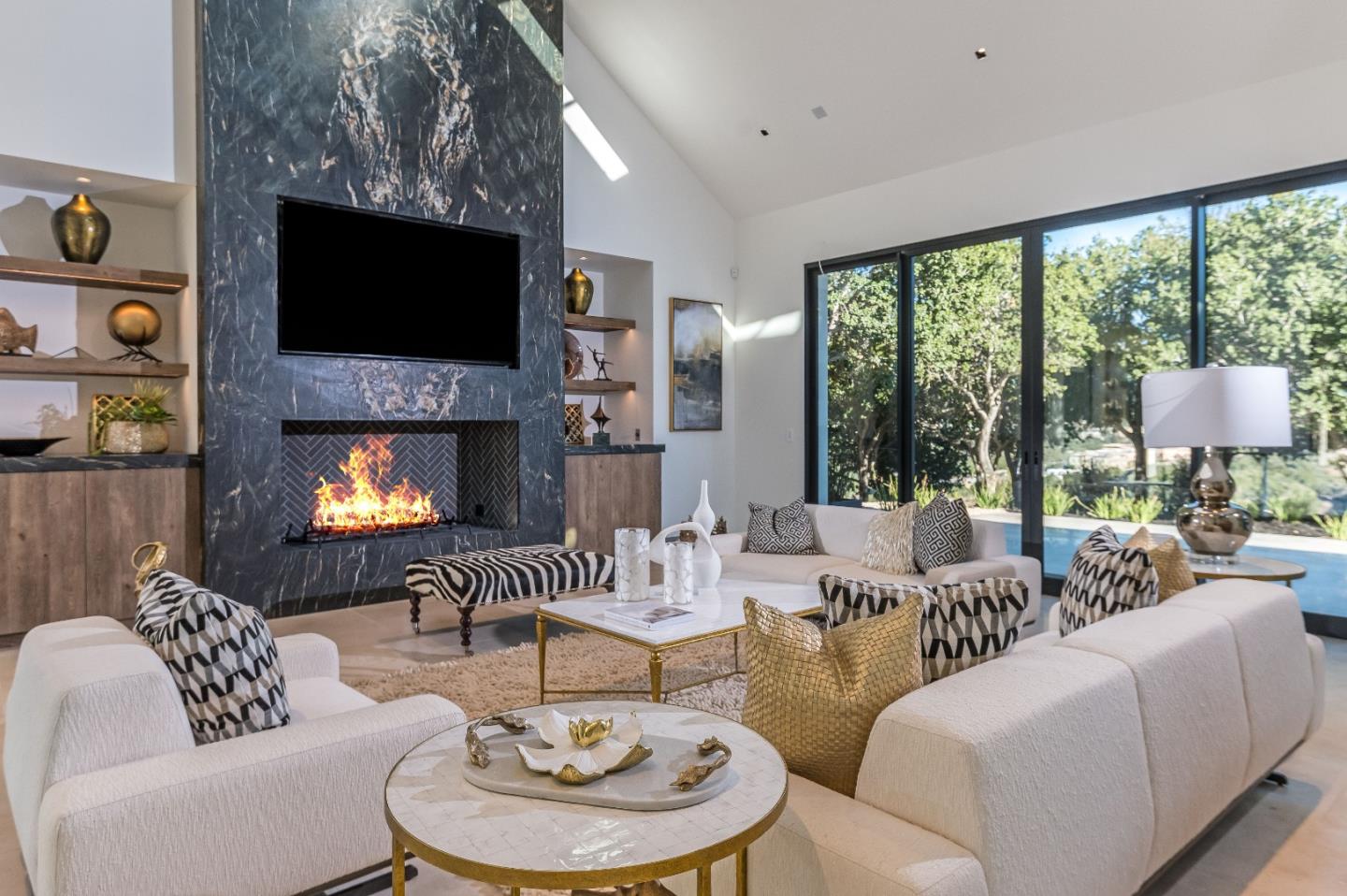 8140 Manjares Road Monterey, CA 93940 - Photo 9 of 20 a living room with furniture a fireplace and a flat screen tv