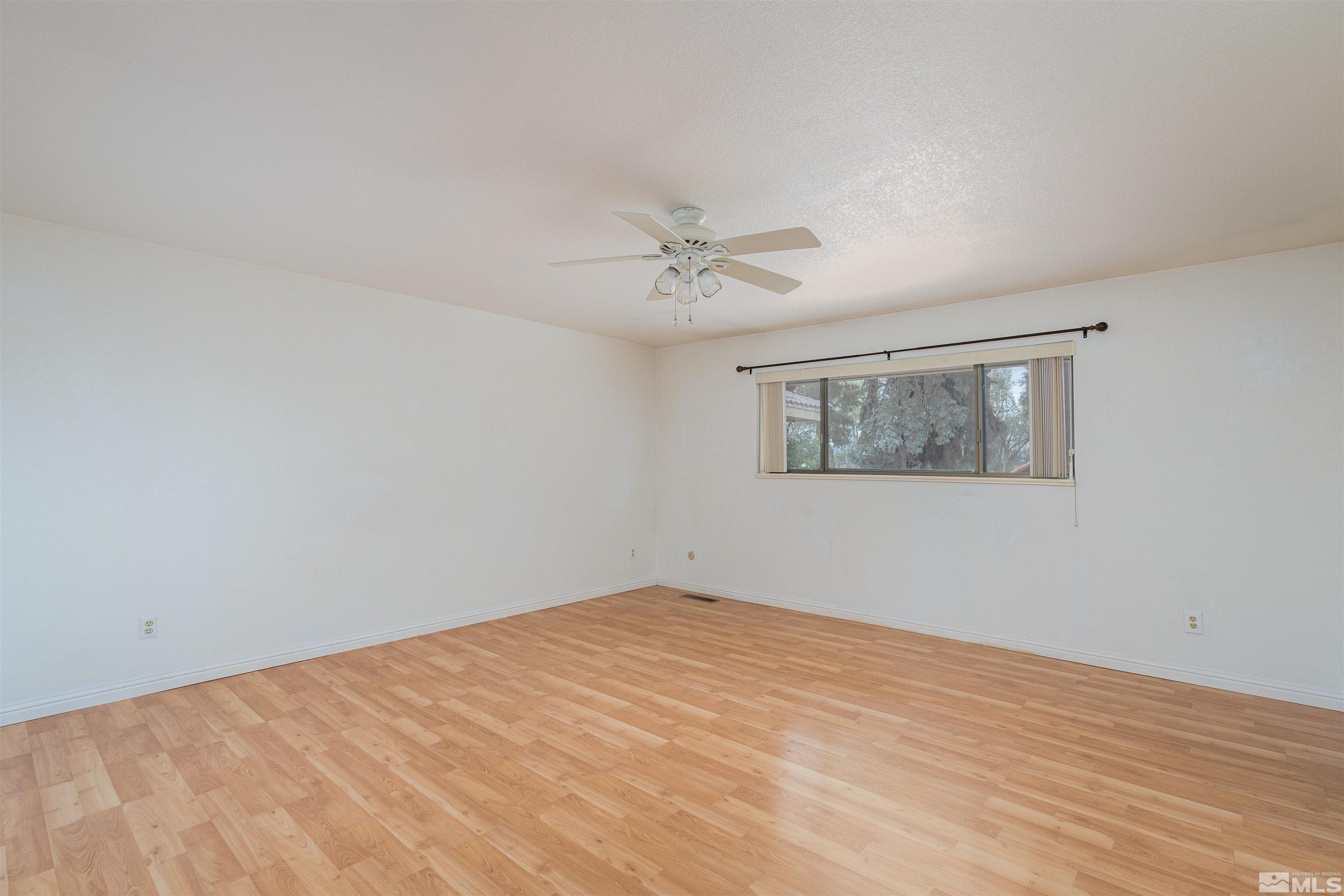 5705 Blue Hills Drive Reno, NV 89502 - Photo 11 of 29 a view of an empty room with a fan