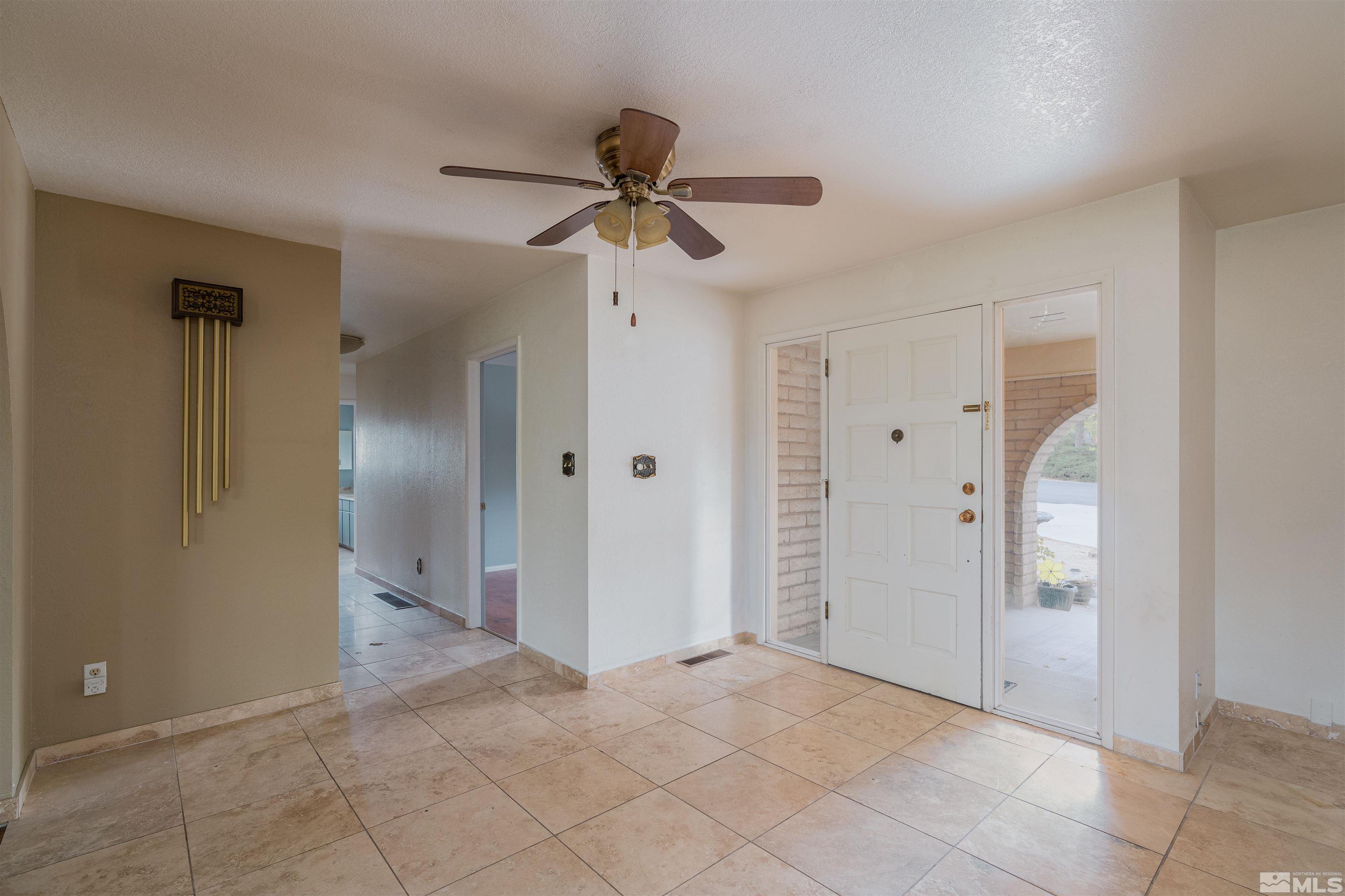 5705 Blue Hills Drive Reno, NV 89502 - Photo 19 of 29 an empty room with closet and a chandelier fan