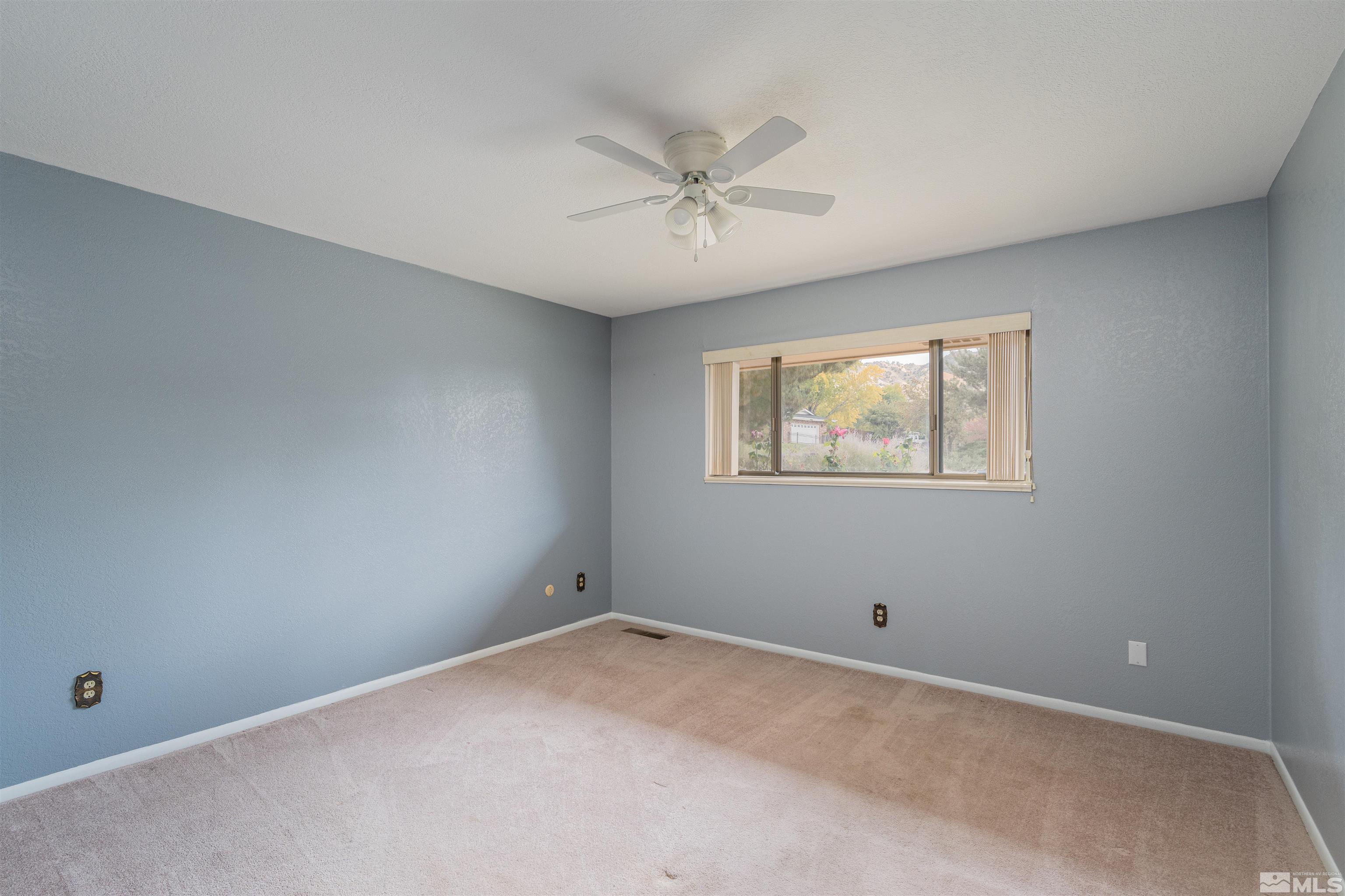 5705 Blue Hills Drive Reno, NV 89502 - Photo 9 of 29 a view of an empty room with a window