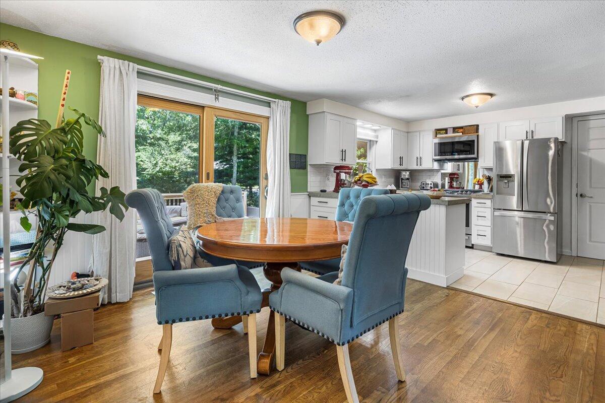 48 Valley Brook Road Centerville, MA 02632 - Photo 14 of 34 a view of a dining room with furniture window and wooden floor